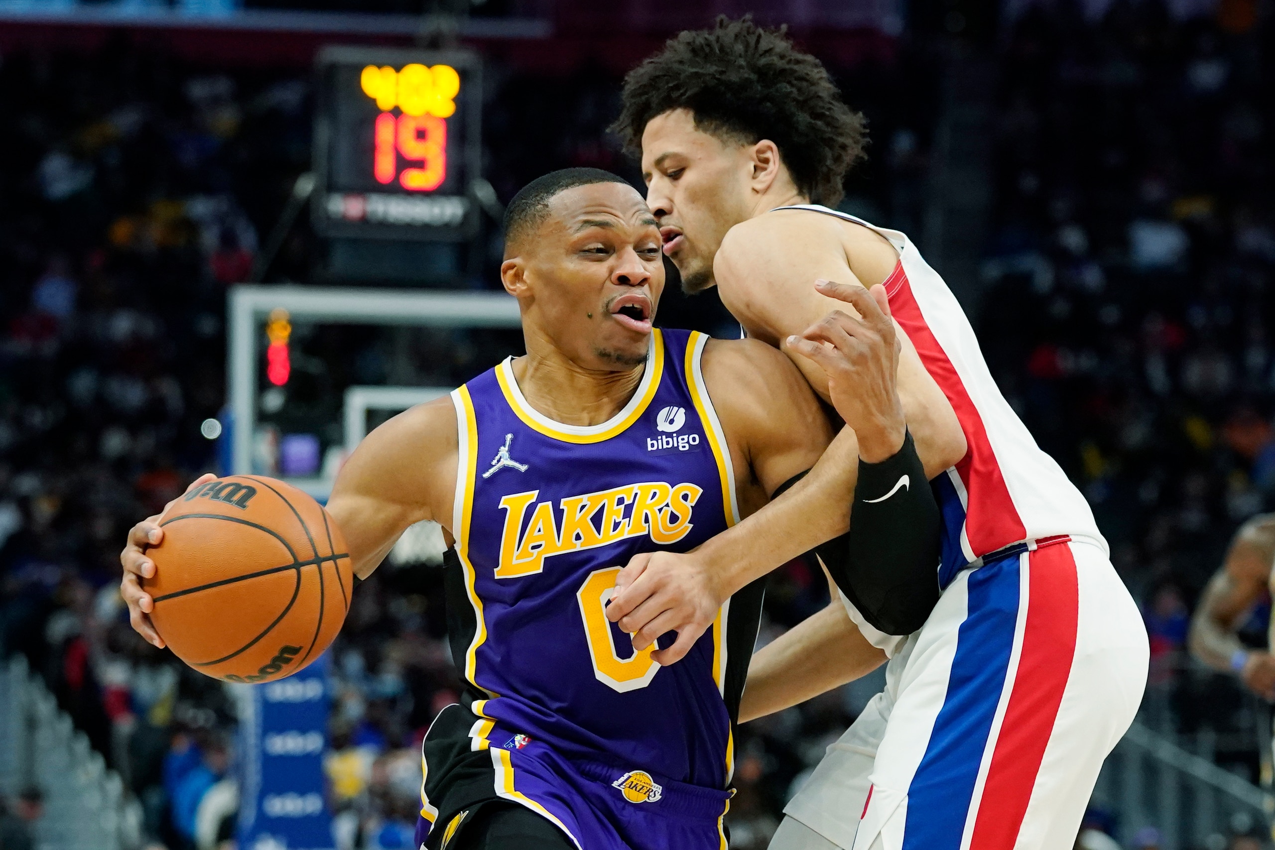 Los Angeles Lakers guard Russell Westbrook (0) is defended by Detroit Pistons guard Cade Cunningham during the first half of an NBA basketball game, Sunday, Nov. 21, 2021, in Detroit. (AP Photo/Carlos Osorio) Los Angeles Lakers guard Russell Westbrook (0) is defended by Detroit Pistons guard Cade Cunningham during the first half of an NBA basketball game, Sunday, Nov. 21, 2021, in Detroit. (AP Photo/Carlos Osorio)