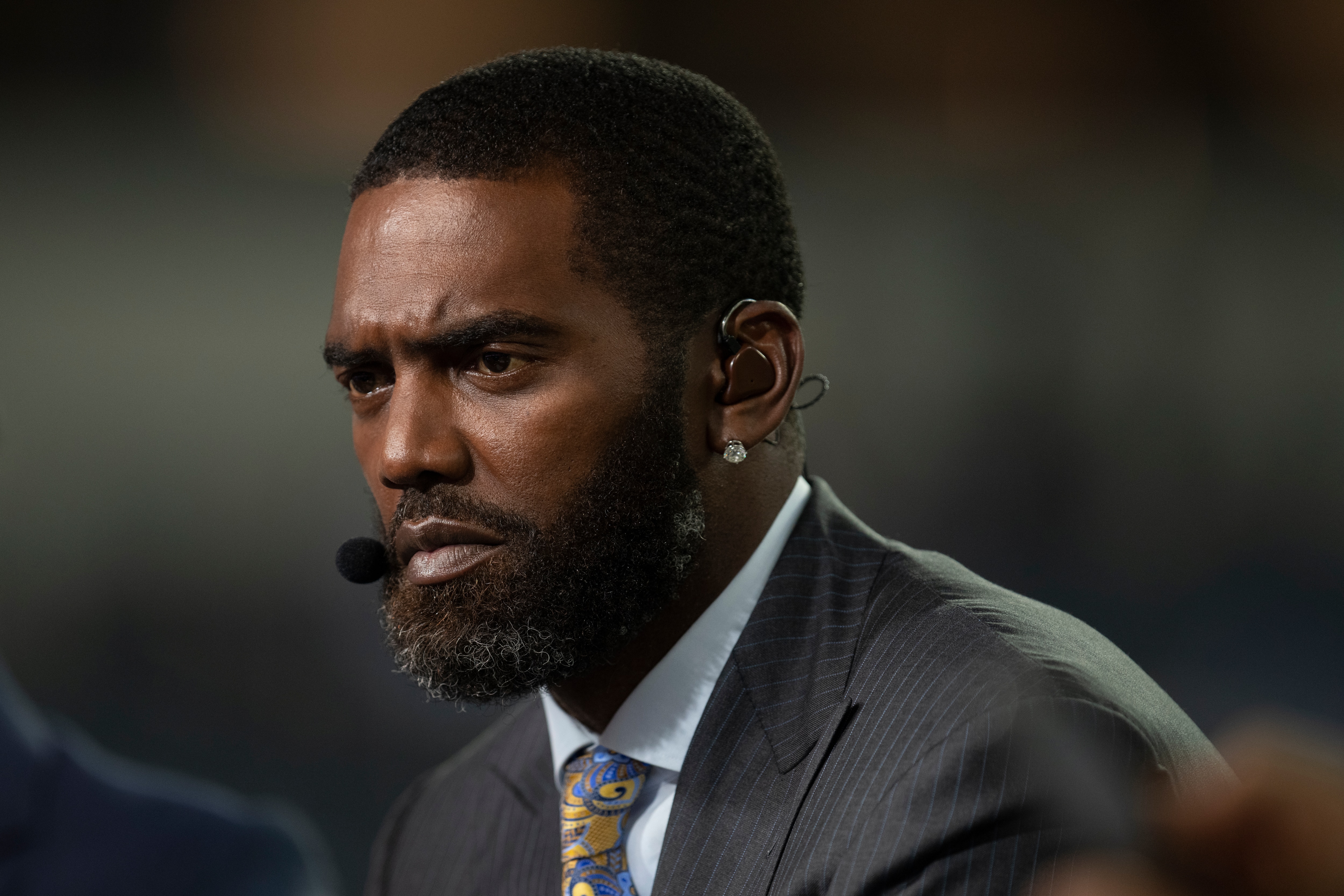 Randy Moss looks on before an NFL football game between the Los Angeles Chargers and the Las Vegas Raiders Monday, Oct. 4, 2021, in Inglewood, Calif. (AP Photo/Kyusung Gong)