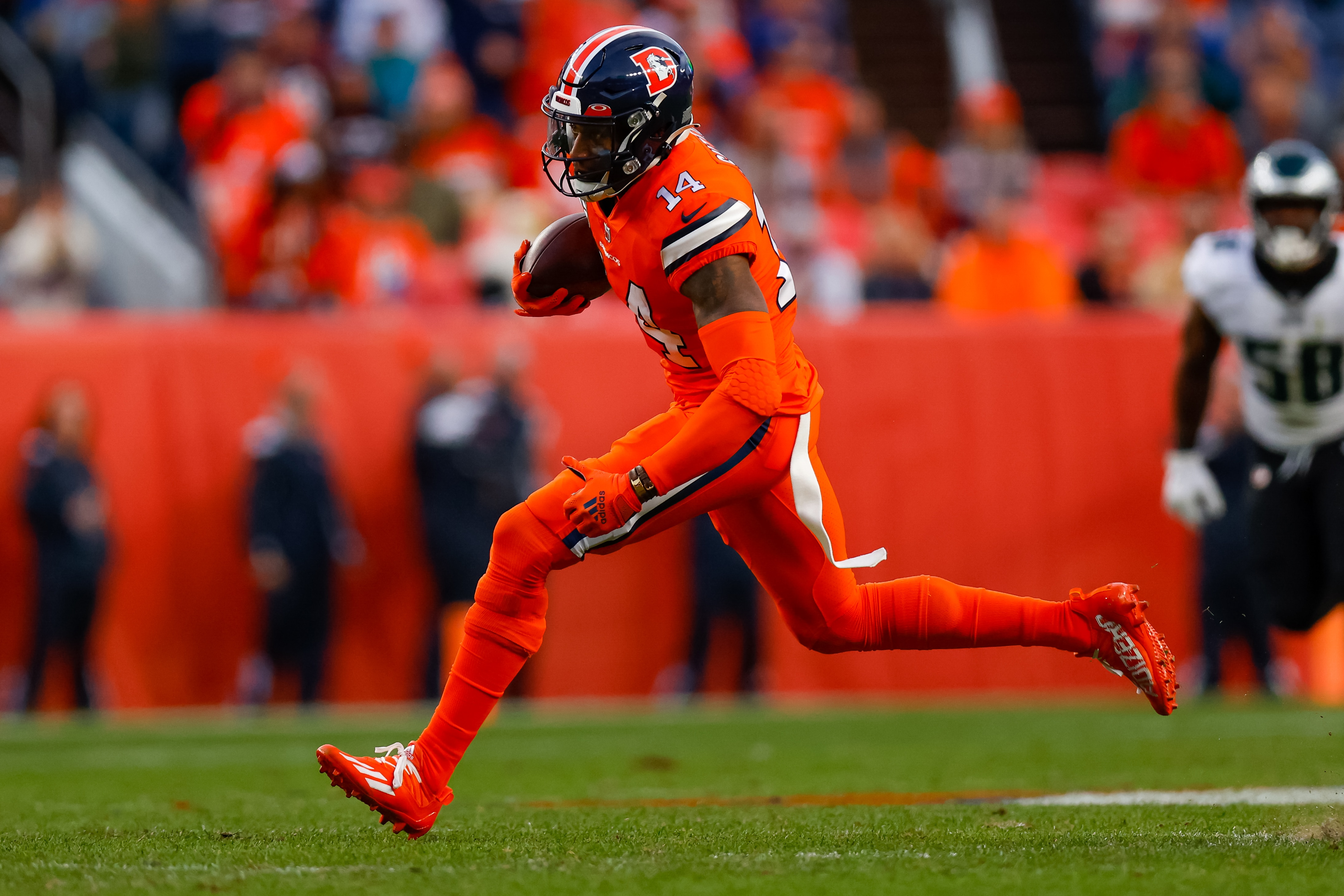 DENVER, CO - NOVEMBER 14:  Wide receiver Courtland Sutton #14 of the Denver Broncos catches a pass during the second half against the Philadelphia Eagles at Empower Field at Mile High on November 14, 2021 in Denver, Colorado. (Photo by Justin Edmonds/Getty Images)