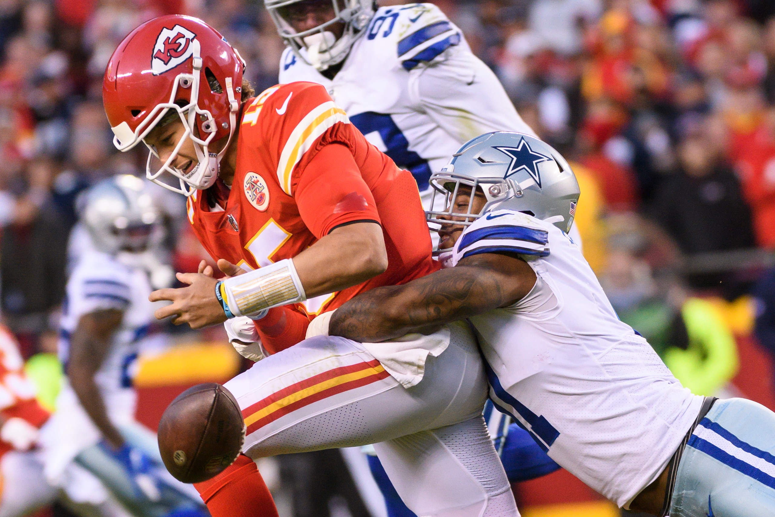Dallas Cowboys outside linebacker Micah Parsons strips the ball from Kansas City Chiefs quarterback Patrick Mahomes during the first half of an NFL football game, Sunday, Nov. 21, 2021 in Kansas City, Mo. (AP Photo/Reed Hoffmann)