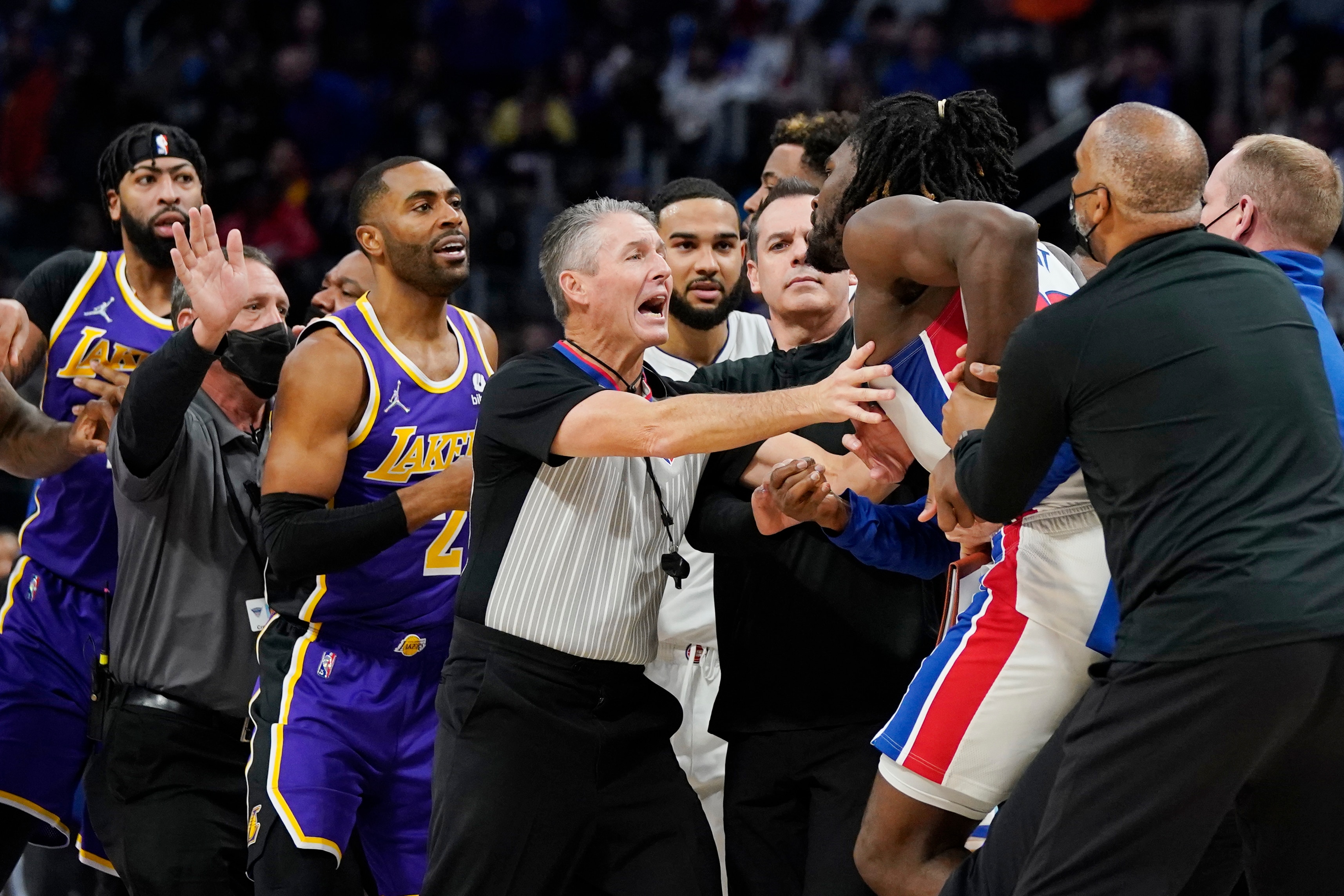 Players separate Detroit Pistons center Isaiah Stewart from Los Angeles Lakers forward LeBron James, not in frame, during the second half of an NBA basketball game, Sunday, Nov. 21, 2021, in Detroit. (AP Photo/Carlos Osorio)