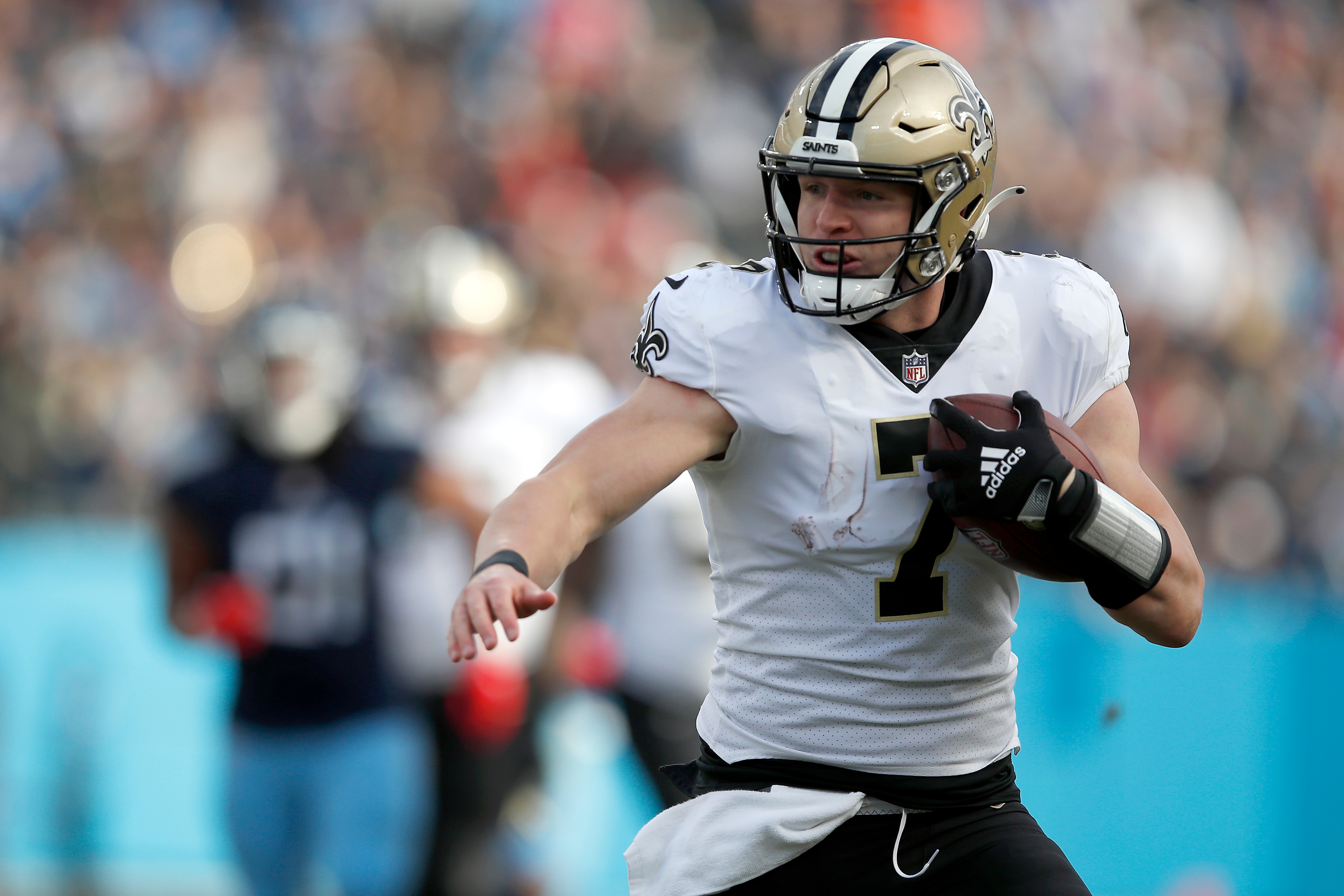 NASHVILLE, TENNESSEE - NOVEMBER 14: Taysom Hill #7 of the New Orleans Saints runs with the ball against the Tennessee Titans in the second half of the game at Nissan Stadium on November 14, 2021 in Nashville, Tennessee. (Photo by Wesley Hitt/Getty Images)