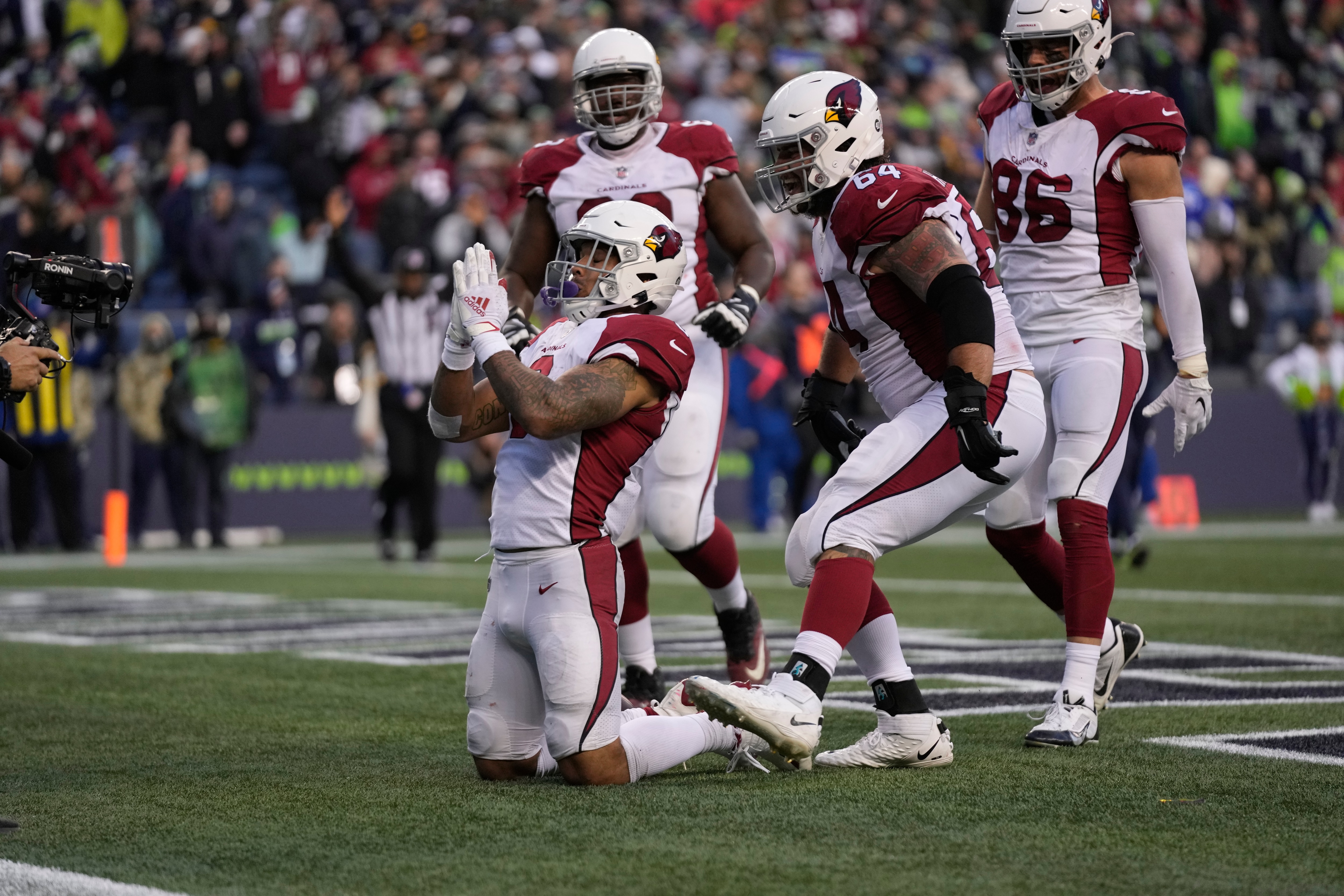 Arizona Cardinals running back James Conner celebrates a touchdown during an NFL football game against the Seattle Seahawks, Sunday, Nov. 21, 2021, in Seattle. The Cardinals won 23-13. (AP Photo/Ben VanHouten)