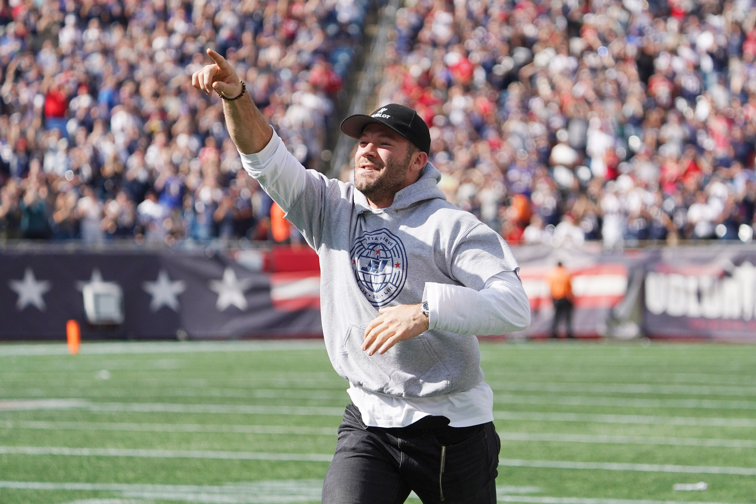 Former New England Patriots wide receiver Julian Edelman acknowledges fans as he runs onto the field while being honored at halftime of an NFL football game against the New Orleans Saints, Sunday, Sept. 26, 2021, in Foxborough, Mass. (AP Photo/Mary Schwalm) Former New England Patriots wide receiver Julian Edelman acknowledges fans as he runs onto the field while being honored at halftime of an NFL football game against the New Orleans Saints, Sunday, Sept. 26, 2021, in Foxborough, Mass. (AP Photo/Mary Schwalm)