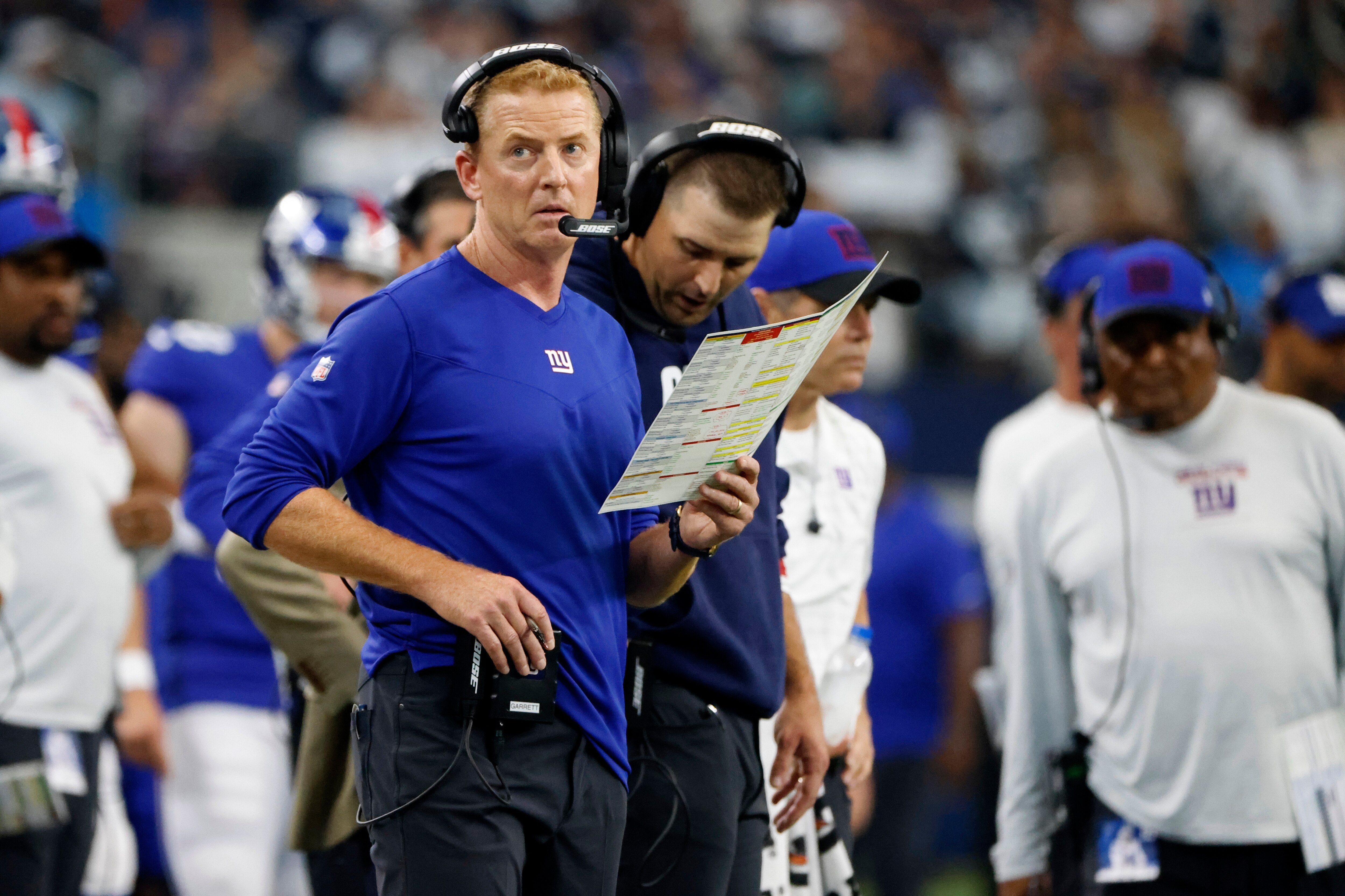 New York Giants offensive coordinator Jason Garrett watches play against the Dallas Cowboys in the first half of an NFL football game in Arlington, Texas, Sunday, Oct. 10, 2021. (AP Photo/Michael Ainsworth)