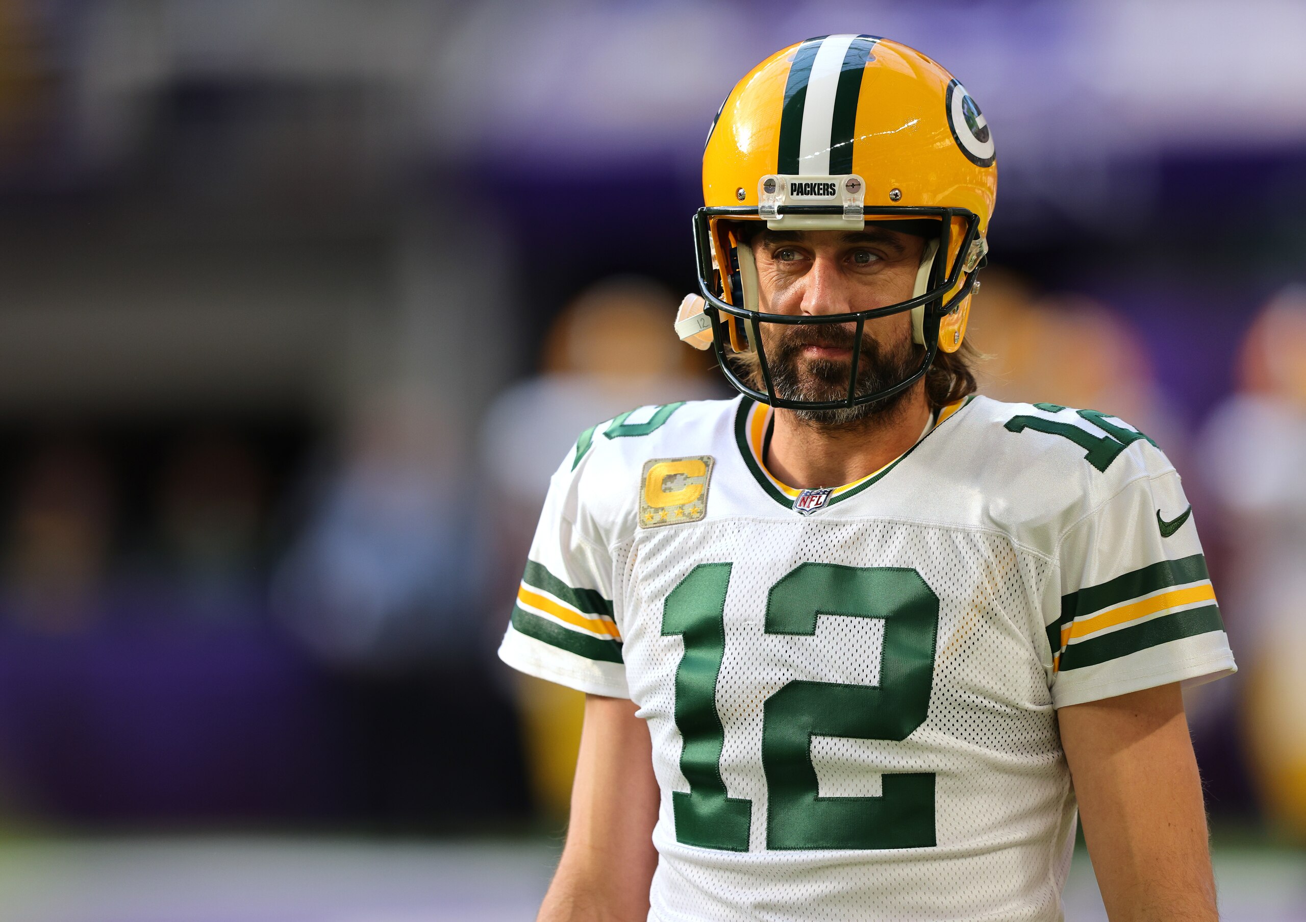 MINNEAPOLIS, MINNESOTA - NOVEMBER 21: Aaron Rodgers #12 of the Green Bay Packers warms up before the game against the Minnesota Vikings at U.S. Bank Stadium on November 21, 2021 in Minneapolis, Minnesota. (Photo by Adam Bettcher/Getty Images)