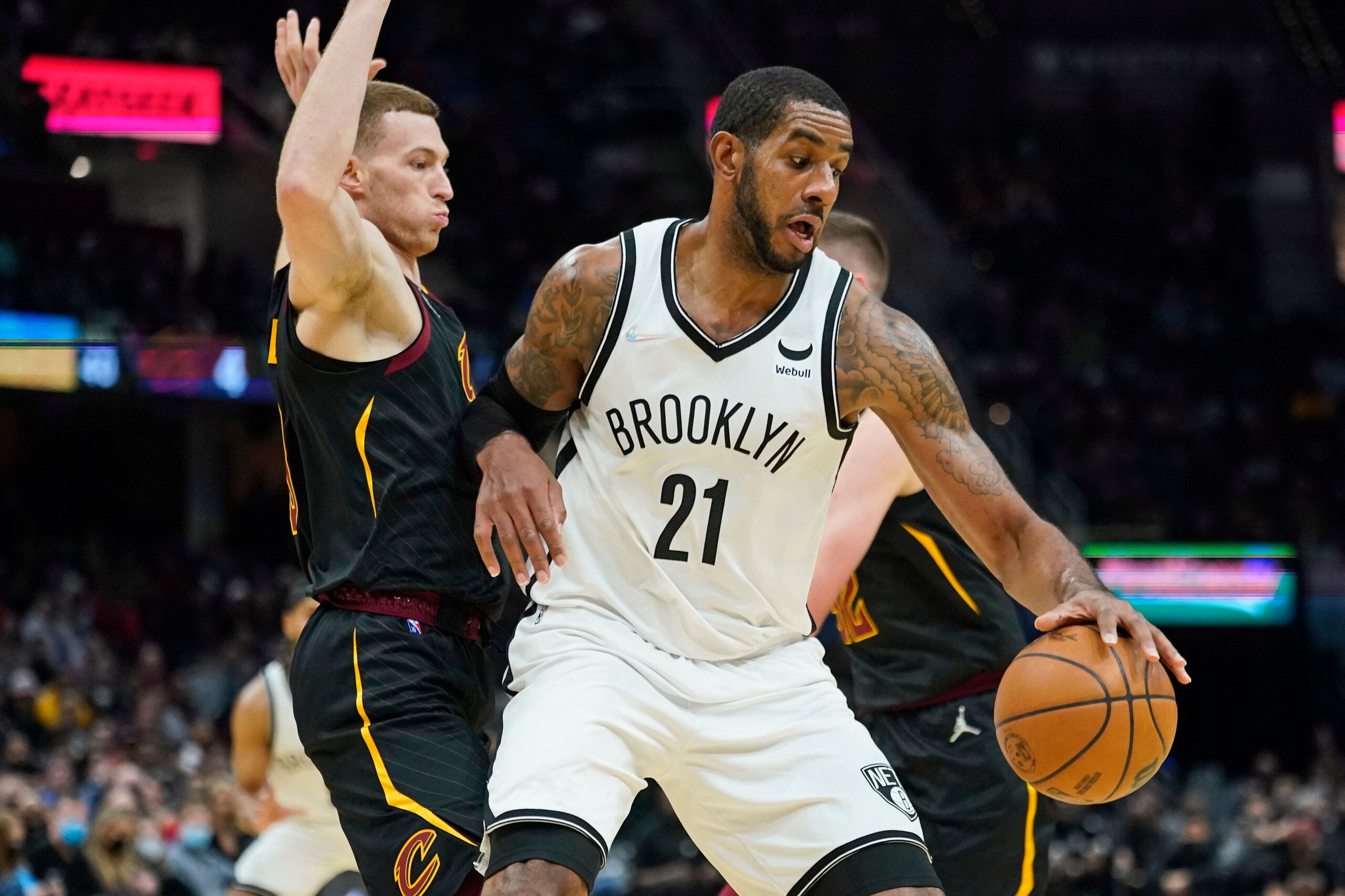 Brooklyn Nets' LaMarcus Aldridge (21) trees to get past Cleveland Cavaliers' Dylan Windler (9) in the second half of an NBA basketball game, Monday, Nov. 22, 2021, in Cleveland. (AP Photo/Tony Dejak)