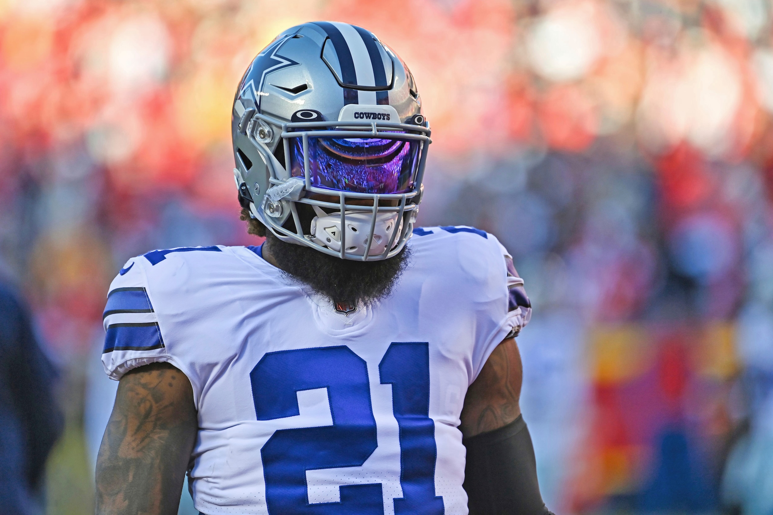 Dallas Cowboys running back Ezekiel Elliott (21) looks on before an NFL football game against the Kansas City Chiefs Sunday, Nov. 21, 2021, in Kansas City, Mo. (AP Photo/Peter Aiken)
