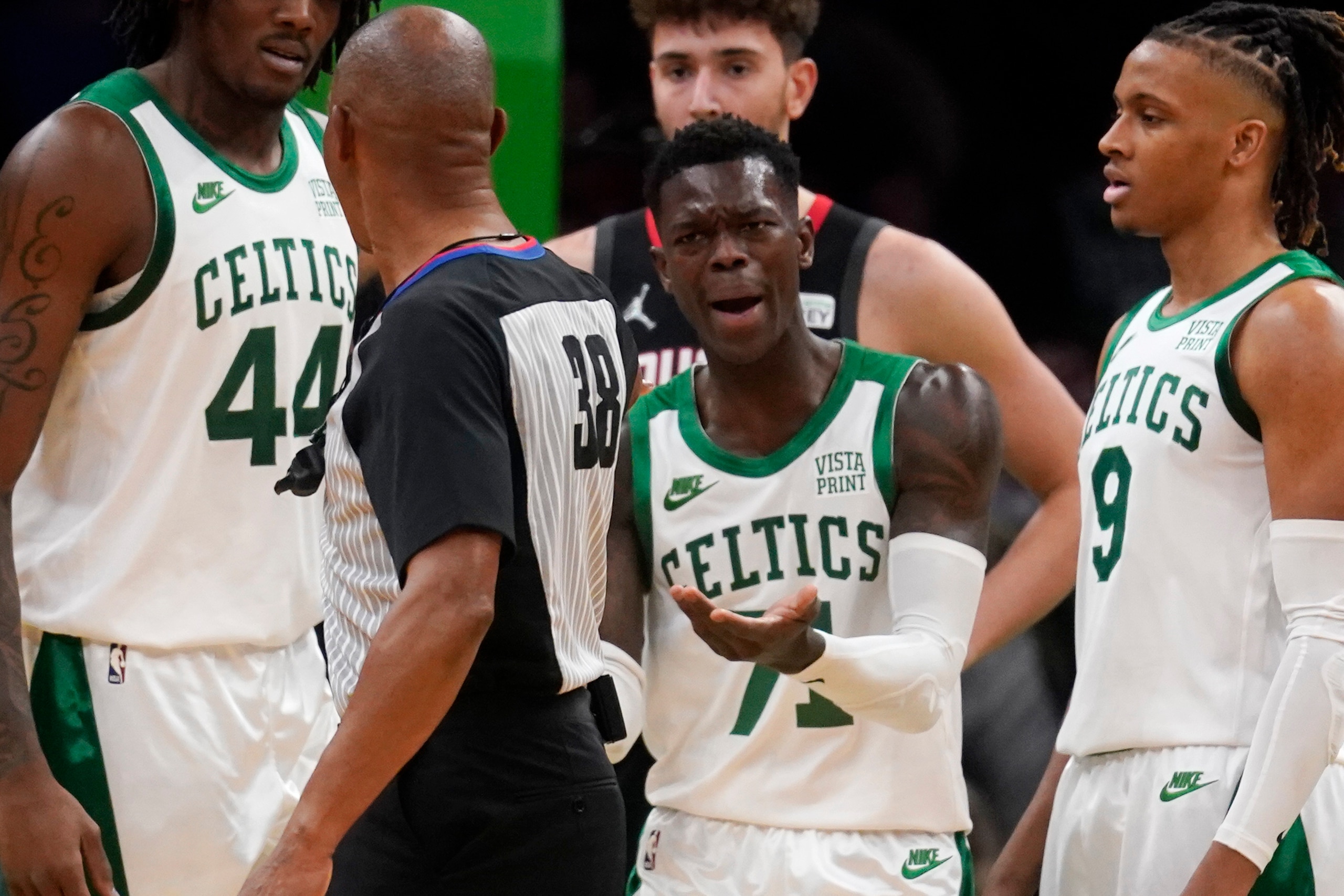 Boston Celtics guard Dennis Schroder (71) argues a call during an NBA basketball game, Monday, Nov. 22, 2021, in Boston. (AP Photo/Charles Krupa)