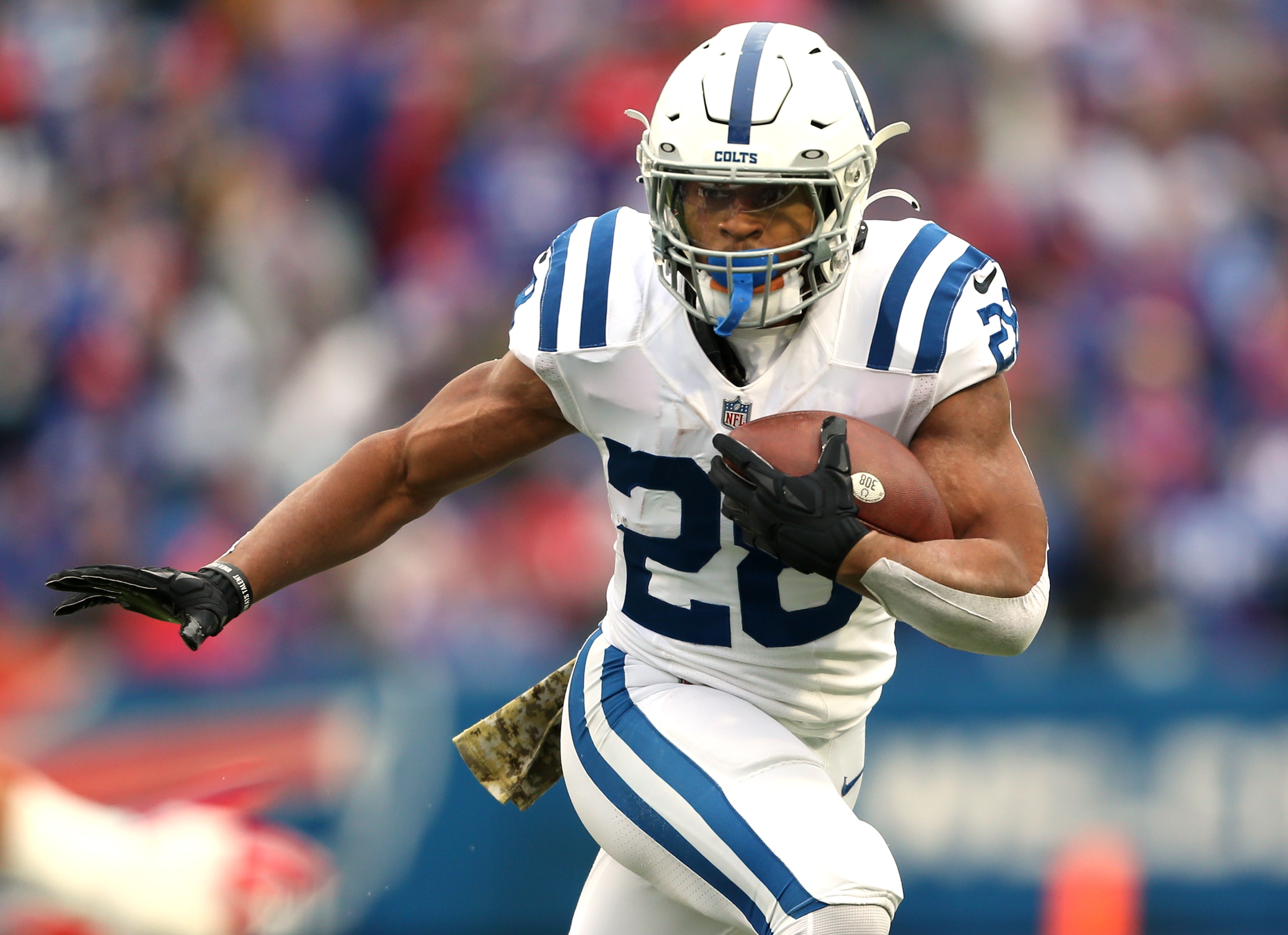 ORCHARD PARK, NEW YORK - NOVEMBER 21: Jonathan Taylor #28 of the Indianapolis Colts runs the ball in the game against the Buffalo Bills during the first quarter at Highmark Stadium on November 21, 2021 in Orchard Park, New York. (Photo by Joshua Bessex/Getty Images)