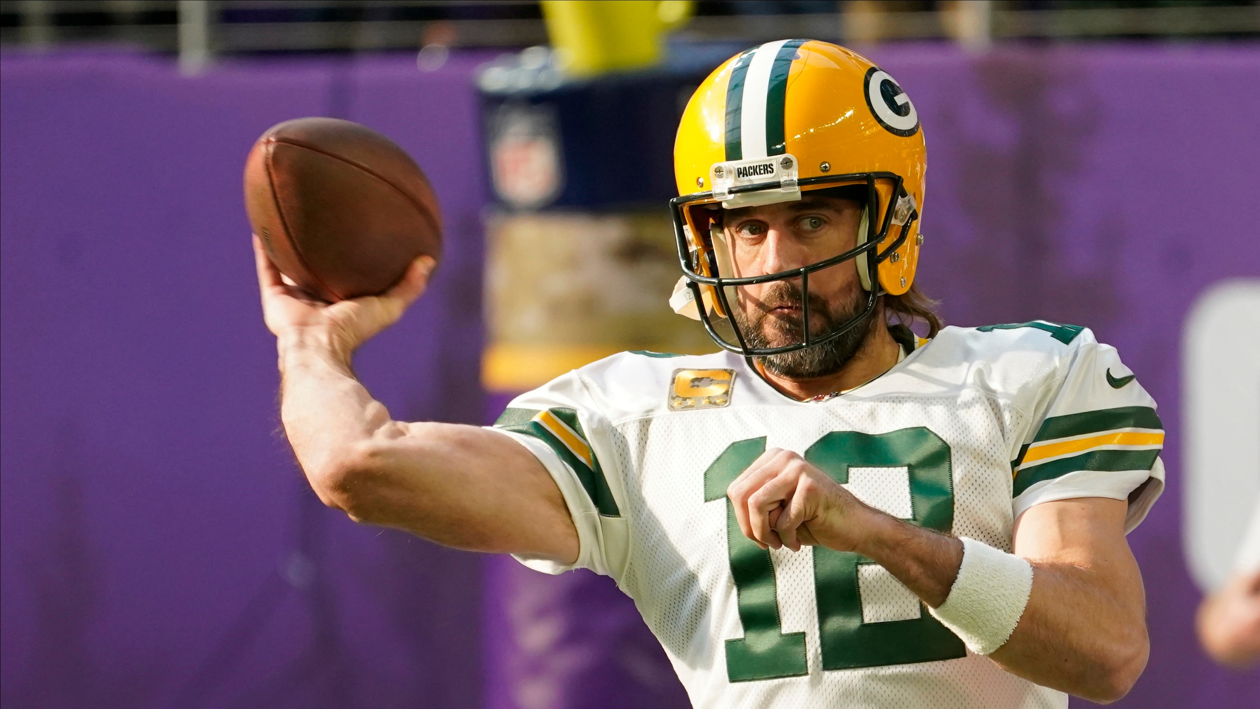 Green Bay Packers quarterback Aaron Rodgers warms up before an NFL football game against the Minnesota Vikings, Sunday, Nov. 21, 2021, in Minneapolis. (AP Photo/Jim Mone)
