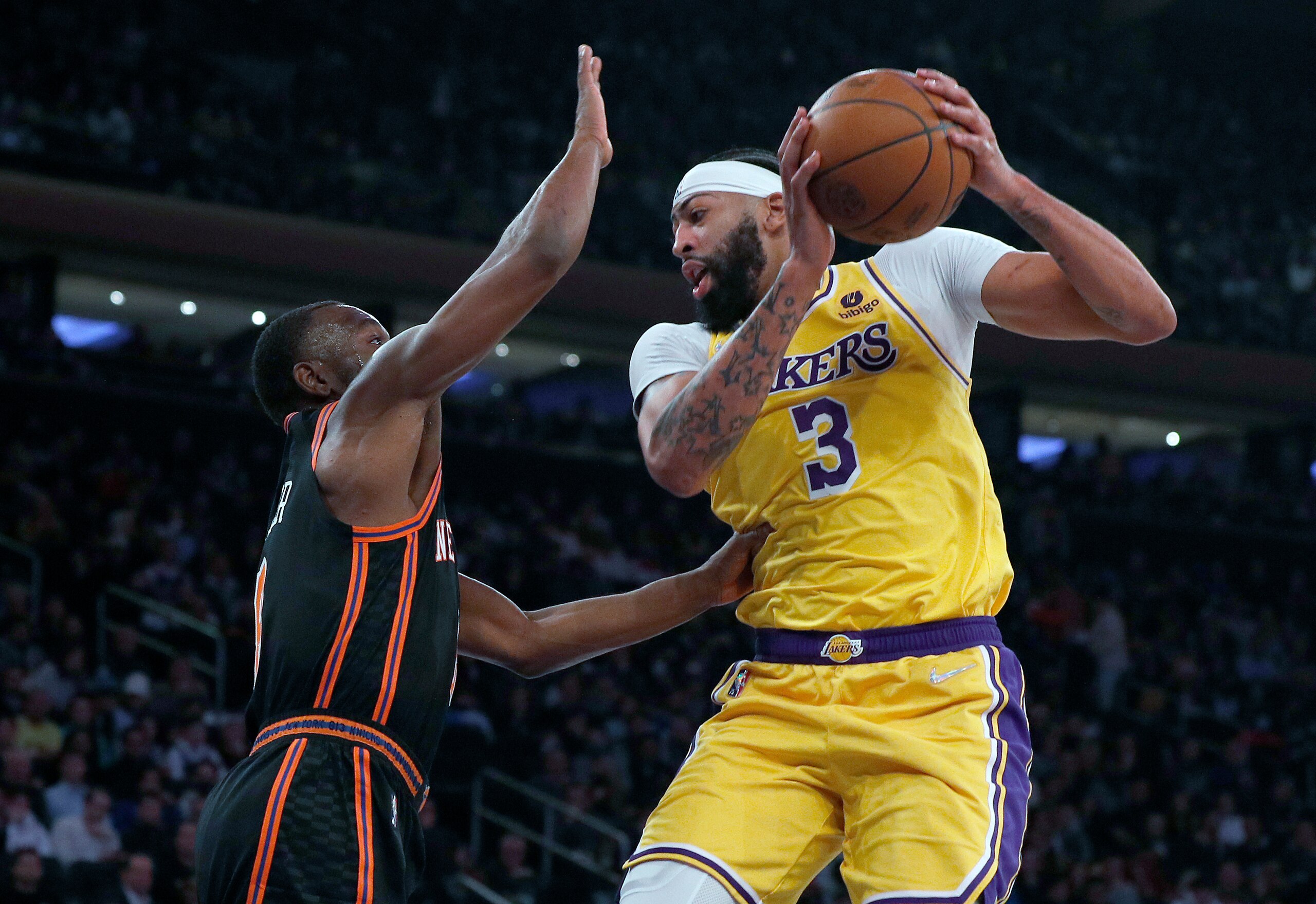 Los Angeles Lakers forward Anthony Davis (3) is defended by New York Knicks guard Kemba Walker (8) during the first half of an NBA basketball game Tuesday, Nov. 23, 2021, in New York. (AP Photo/Jim McIsaac) Los Angeles Lakers forward Anthony Davis (3) is defended by New York Knicks guard Kemba Walker (8) during the first half of an NBA basketball game Tuesday, Nov. 23, 2021, in New York. (AP Photo/Jim McIsaac)