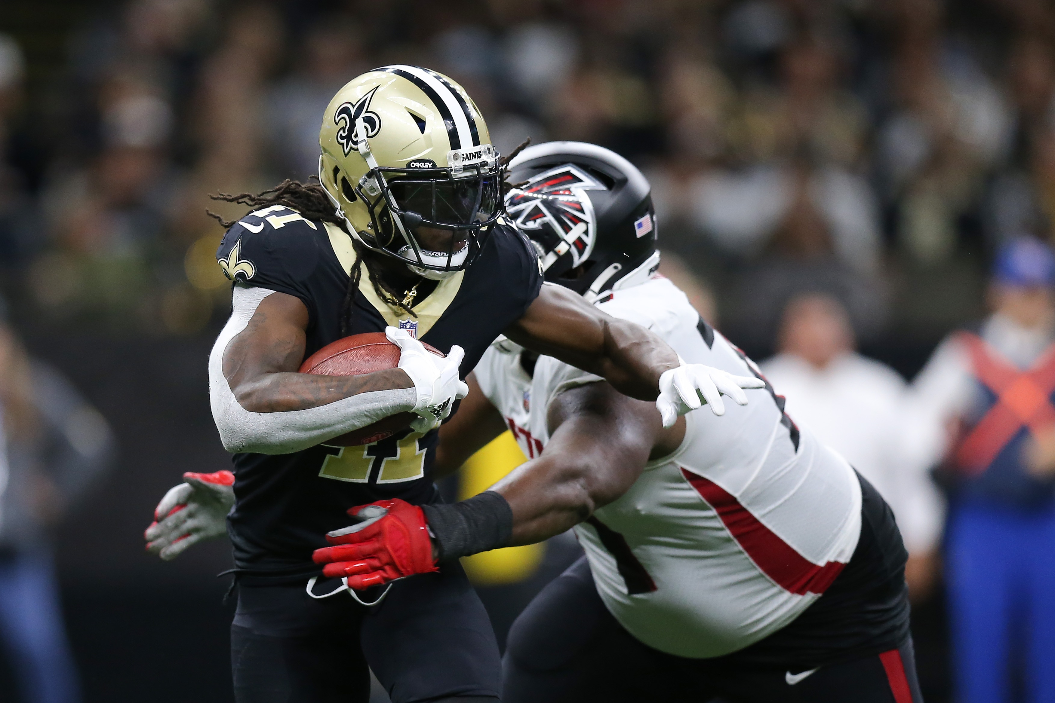 NEW ORLEANS, LOUISIANA - NOVEMBER 07: Alvin Kamara #41 of the New Orleans Saints runs the ball during the fourth quarter in the game against the Atlanta Falcons at Caesars Superdome on November 07, 2021 in New Orleans, Louisiana. (Photo by Jonathan Bachman/Getty Images)