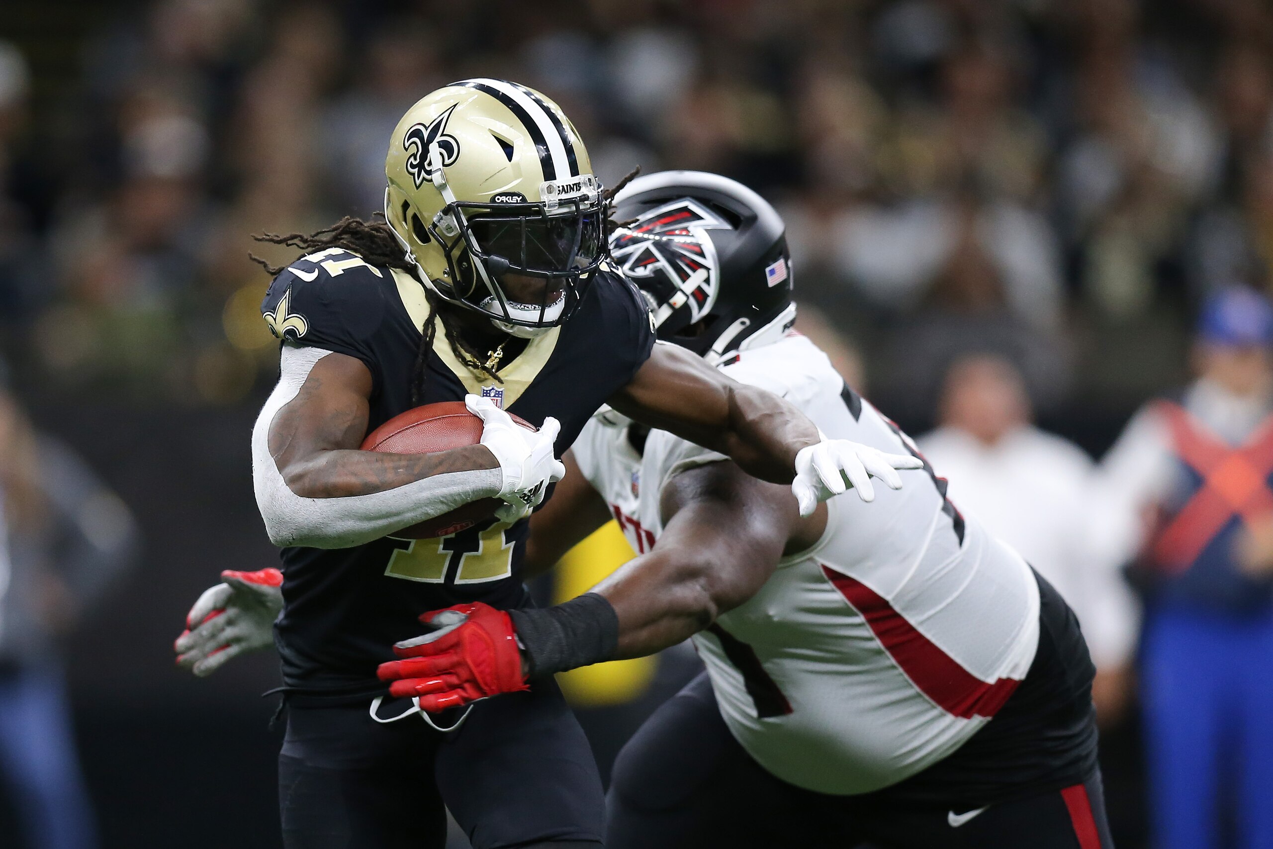 NEW ORLEANS, LOUISIANA - NOVEMBER 07: Alvin Kamara #41 of the New Orleans Saints runs the ball during the fourth quarter in the game against the Atlanta Falcons at Caesars Superdome on November 07, 2021 in New Orleans, Louisiana. (Photo by Jonathan Bachman/Getty Images)