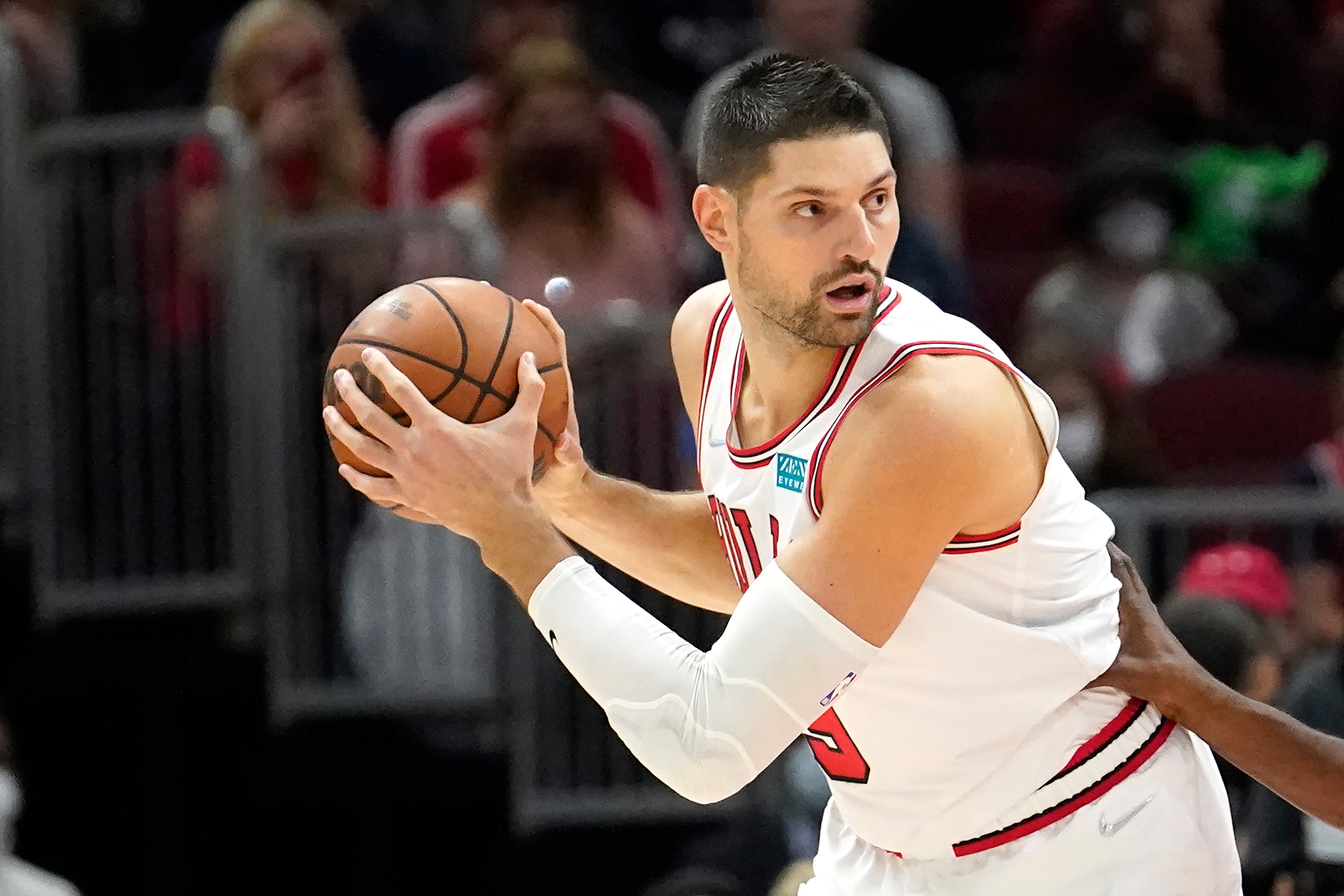 Chicago Bulls' Nikola Vucevic looks to pass in an NBA basketball game against the Philadelphia 76ers Saturday, Nov. 6, 2021, in Chicago. (AP Photo/Charles Rex Arbogast)