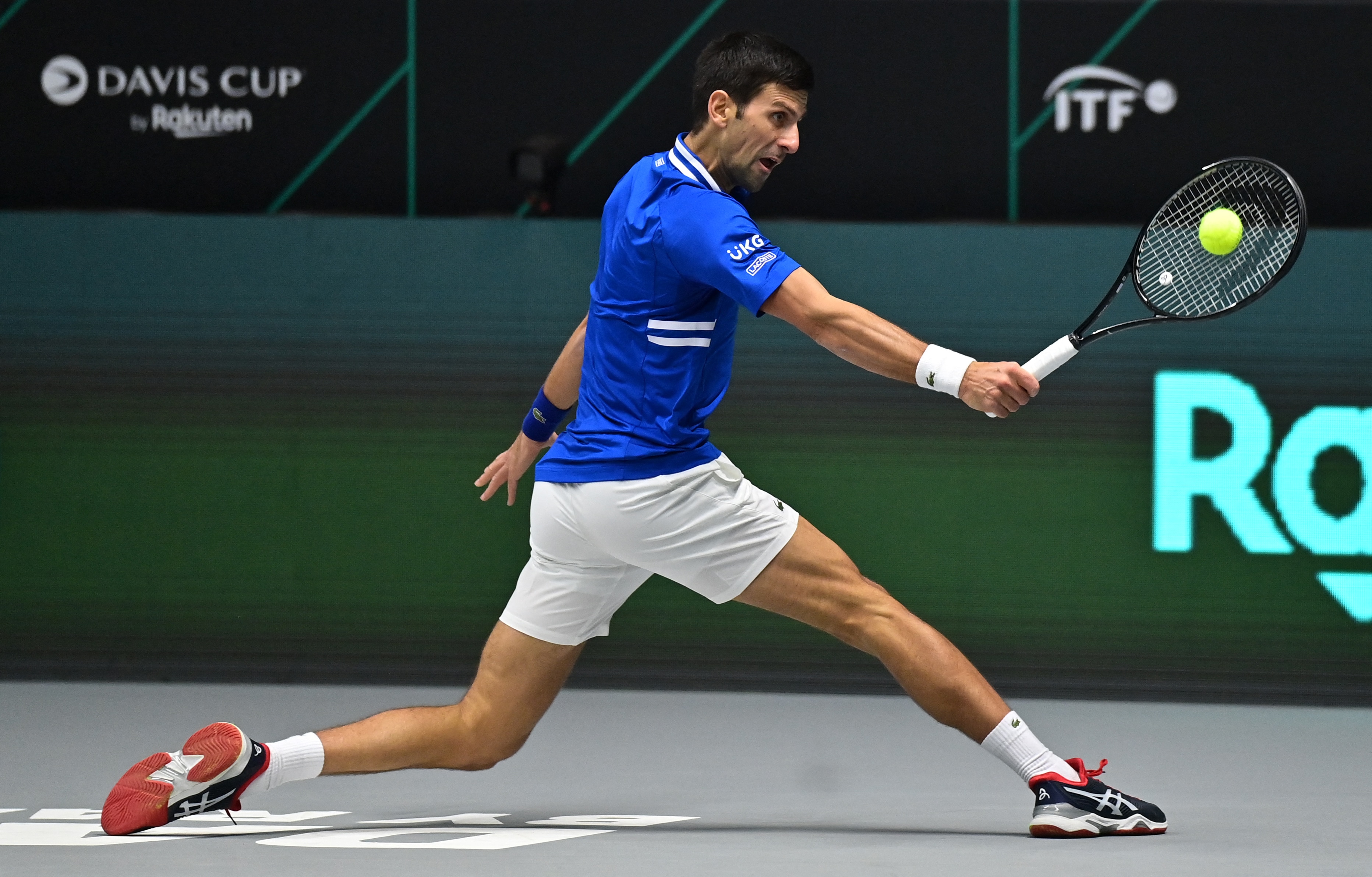 Serbia's Novak Djokovic returns the ball to Austria's Dennis Novak (not pictured) during the men's singles group stage match between Serbia and Austria at the Davis Cup tennis tournament in Innsbruck, Austria, on November 26, 2021. (Photo by JOE KLAMAR / AFP) (Photo by JOE KLAMAR/AFP via Getty Images)