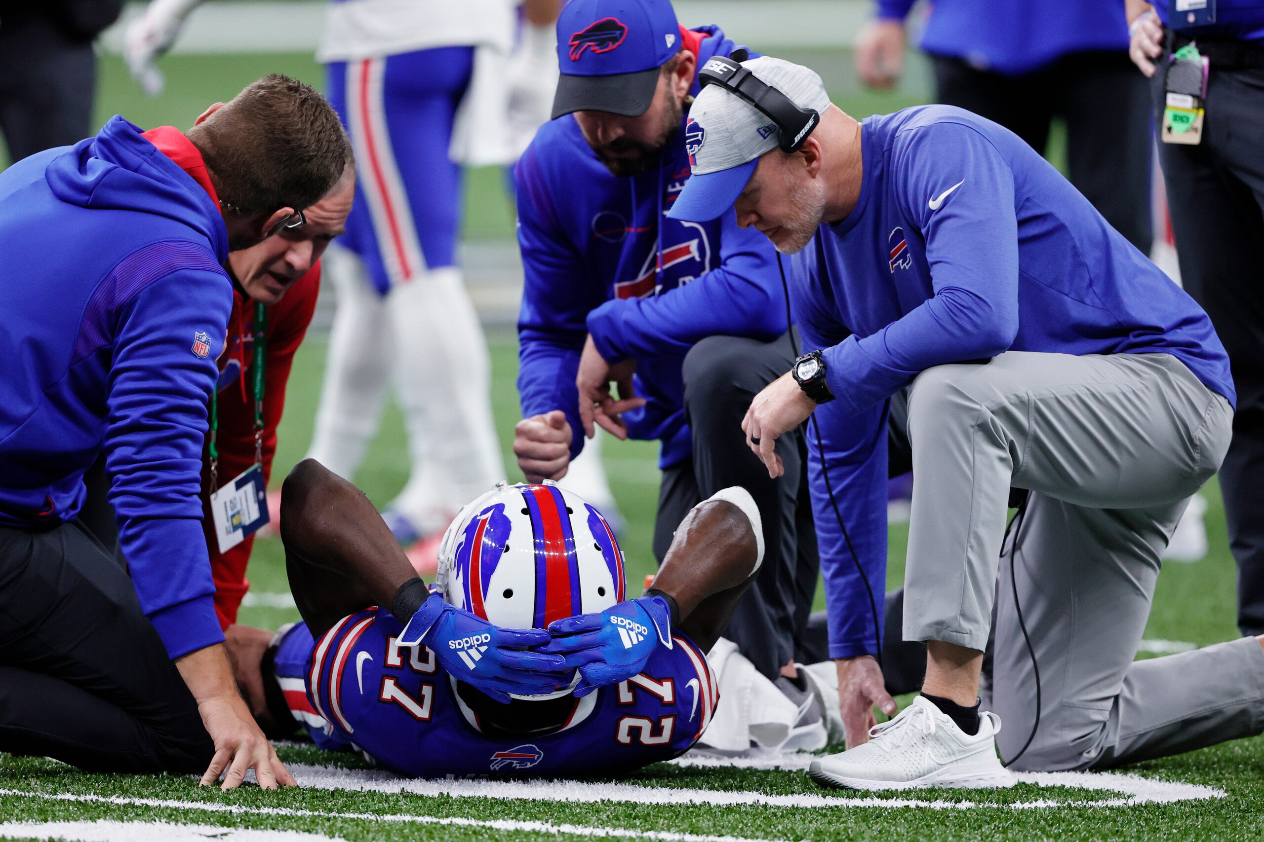 An injured Buffalo Bills cornerback Tre'Davious White (27) is helped by head coach Sean McDermott, right, and medical staff in the first half of an NFL football game against the New Orleans Saints in New Orleans, Thursday, Nov. 25, 2021. (AP Photo/Butch Dill)