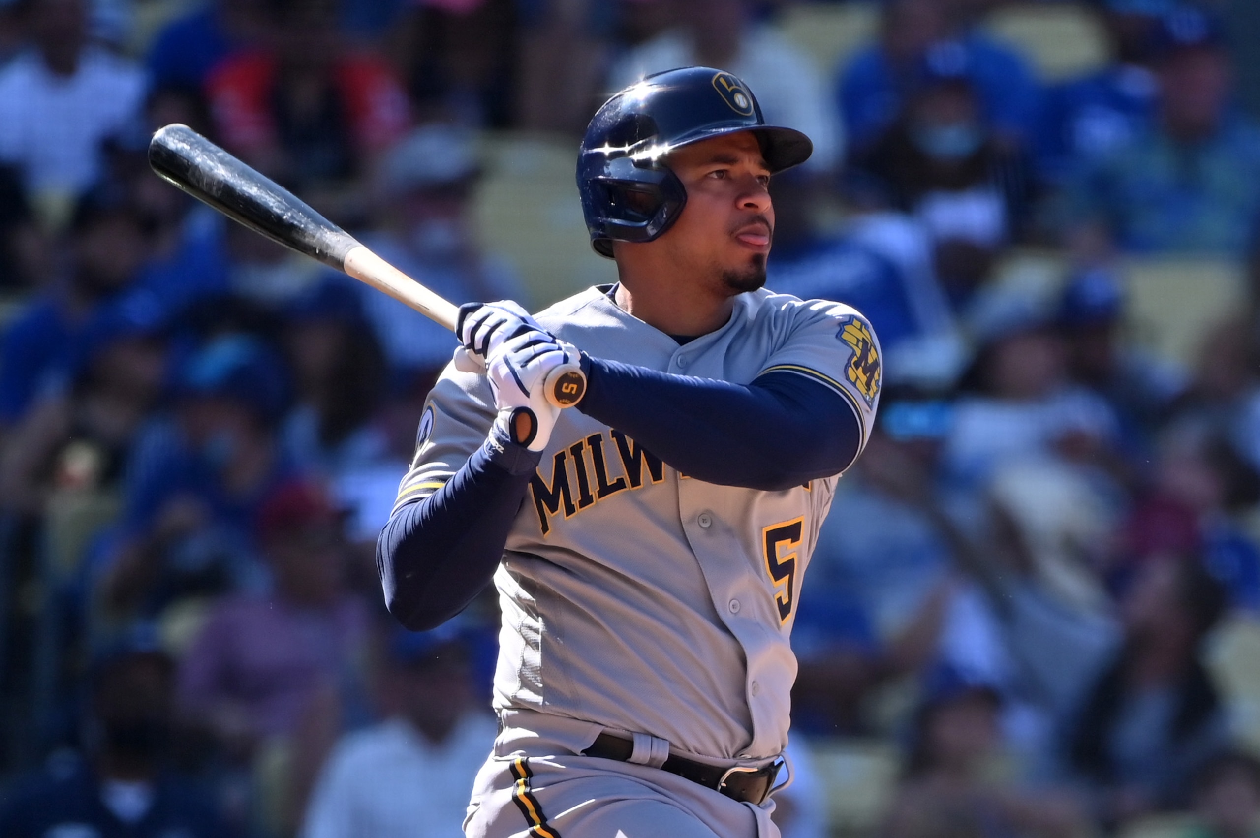 LOS ANGELES, CALIFORNIA - OCTOBER 03: Eduardo Escobar #5 of the Milwaukee Brewers bats during a game agains the Los Angeles Dodgers at Dodger Stadium on October 03, 2021 in Los Angeles, California. (Photo by Jonathan Moore/Getty Images)