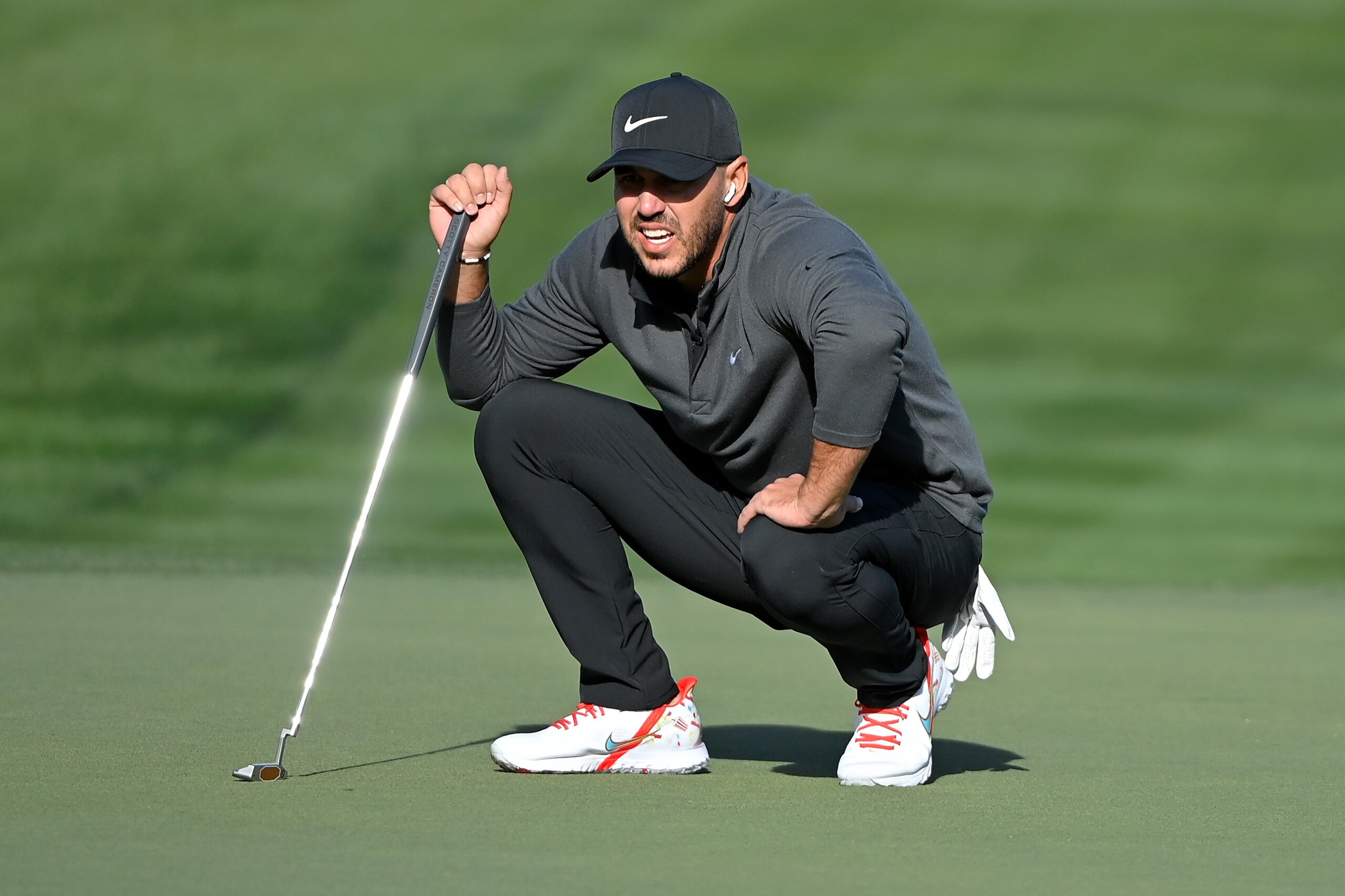LAS VEGAS, NEVADA - NOVEMBER 26: Brooks Koepka lines up a putt on the second green during Capital One's The Match V: Bryson v Brooks at Wynn Golf Course on November 26, 2021 in Las Vegas, Nevada. (Photo by David Becker/Getty Images for The Match)
