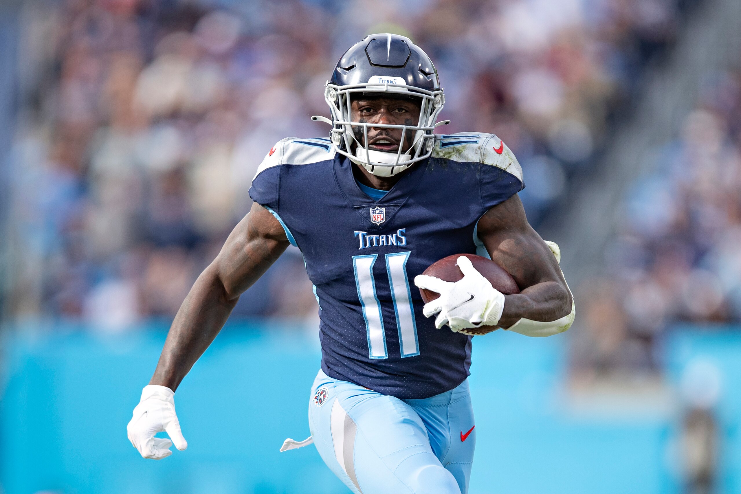 NASHVILLE, TENNESSEE - NOVEMBER 14:  A.J. Brown #11 of the Tennessee Titans runs the ball during a game against the New Orleans Saints at Nissan Stadium on November 14, 2021 in Nashville, Tennessee.  The Titans defeated the Saints 23-21.  (Photo by Wesley Hitt/Getty Images)
