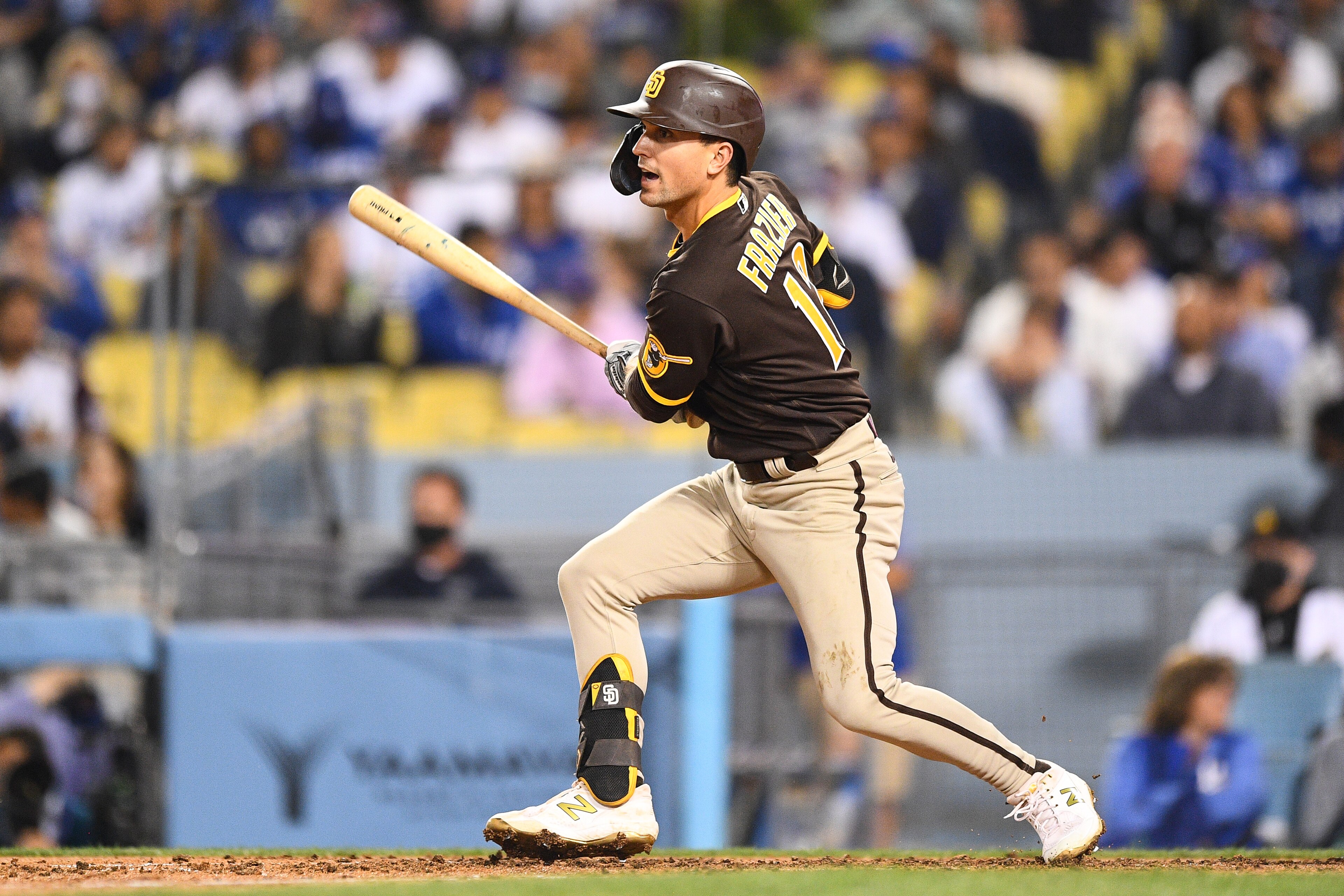 LOS ANGELES, CA - SEPTEMBER 28: San Diego Padres left fielder Adam Frazier (12) swings at a pitch during the MLB game between the San Diego Padres and the Los Angeles Dodgers on September 28, 2021 at Dodger Stadium in Los Angeles, CA. (Photo by Brian Rothmuller/Icon Sportswire via Getty Images)