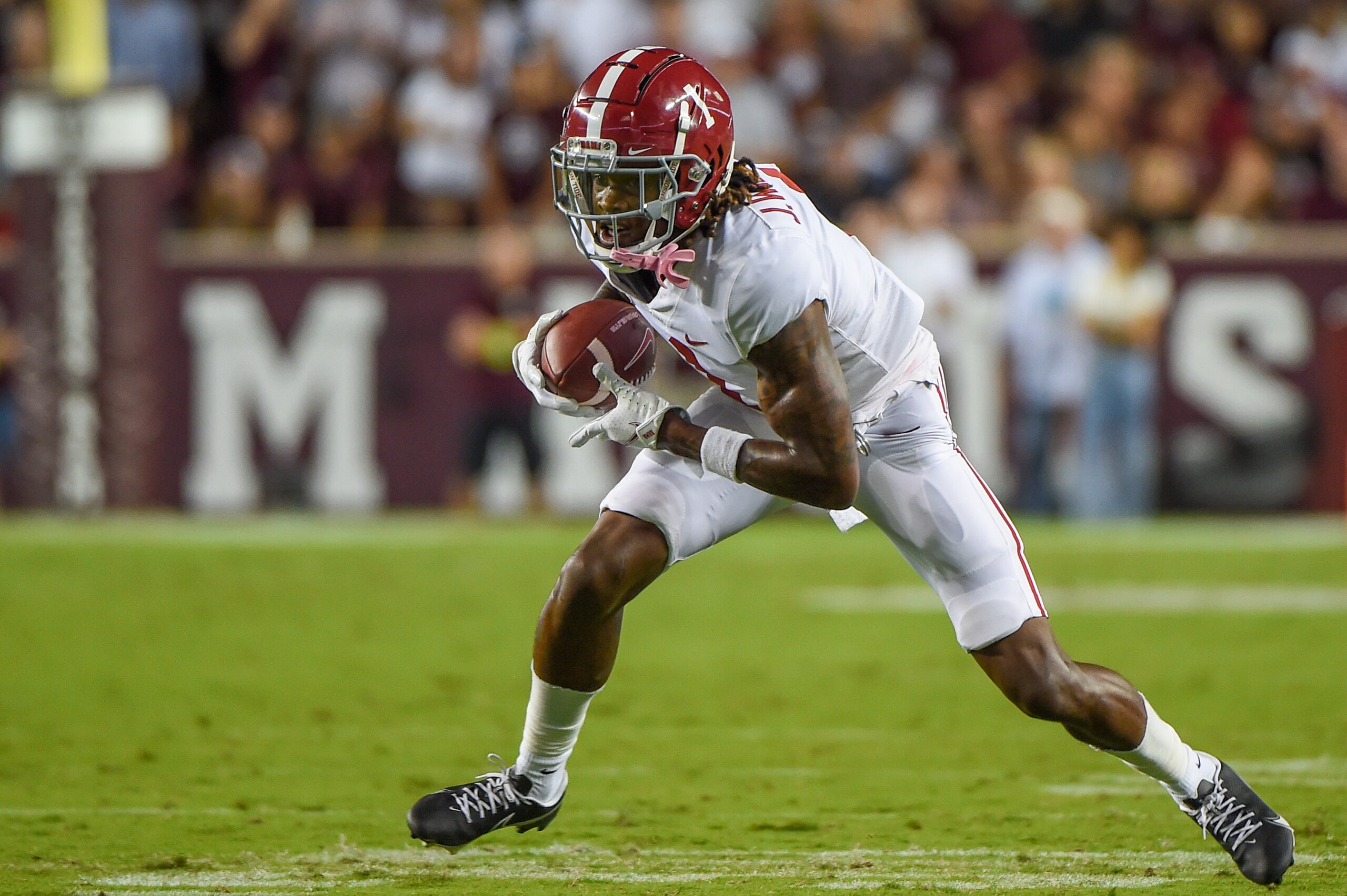COLLEGE STATION, TX - OCTOBER 09: Alabama Crimson Tide wide receiver Jameson Williams (1) looks for running room following a first half reception during a game between the Alabama Crimson Tide and the Texas A&M Aggies at Kyle Field on October 9, 2021 in College Station, Texas. (Photo by Ken Murray/Icon Sportswire via Getty Images)