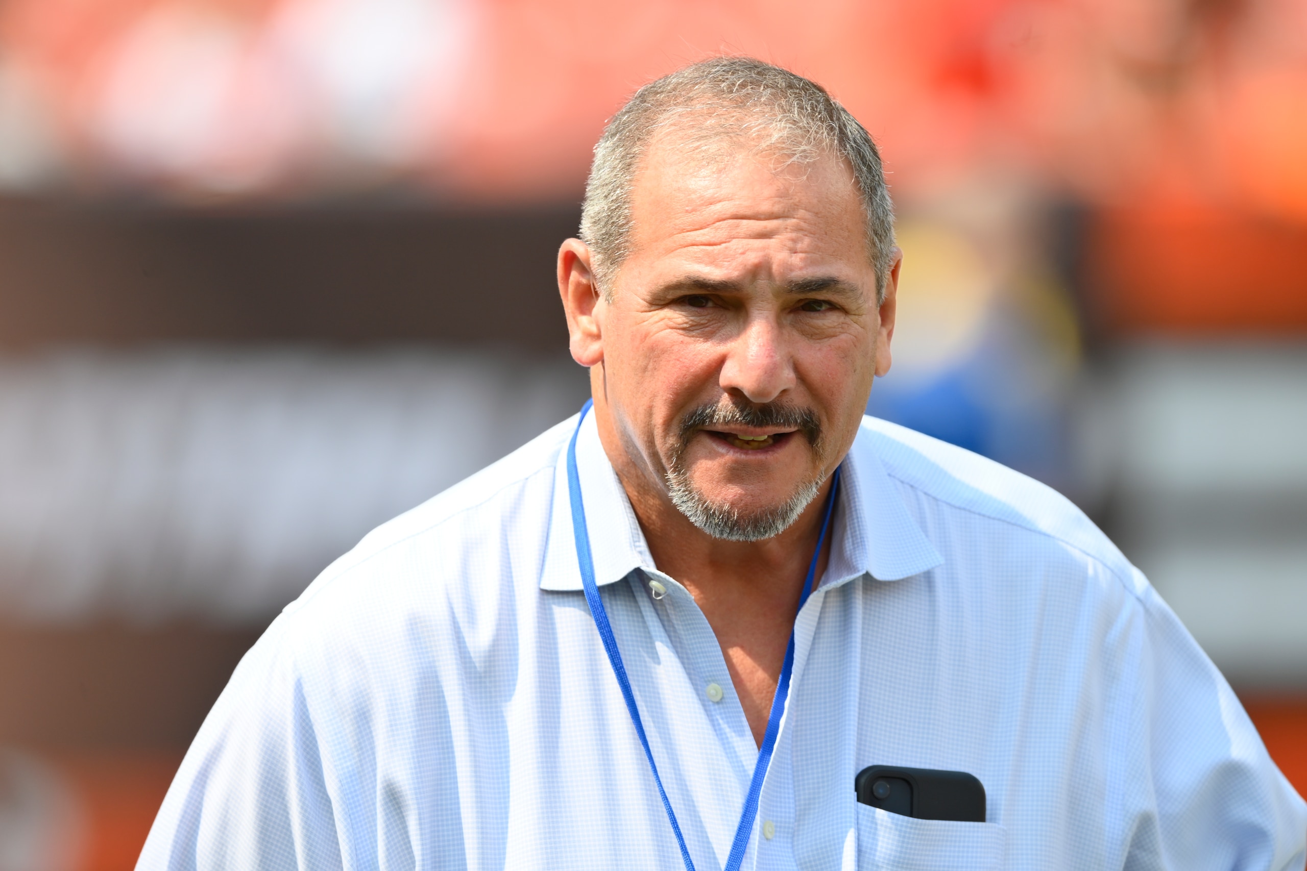 New York Giants general manager Dave Gettleman walks on the field before an NFL preseason football game against the Cleveland Browns, Sunday, Aug. 22, 2021, in Cleveland. The Browns won 17-13. (AP Photo/David Richard)