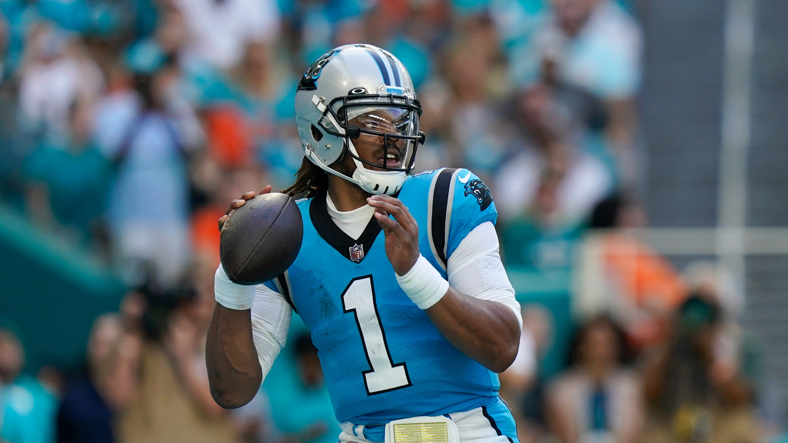 Carolina Panthers quarterback Cam Newton (1) looks to pass during the first half of an NFL football game against the Miami Dolphins, Sunday, Nov. 28, 2021, in Miami Gardens, Fla. (AP Photo/Lynne Sladky) Carolina Panthers quarterback Cam Newton (1) looks to pass during the first half of an NFL football game against the Miami Dolphins, Sunday, Nov. 28, 2021, in Miami Gardens, Fla. (AP Photo/Lynne Sladky)