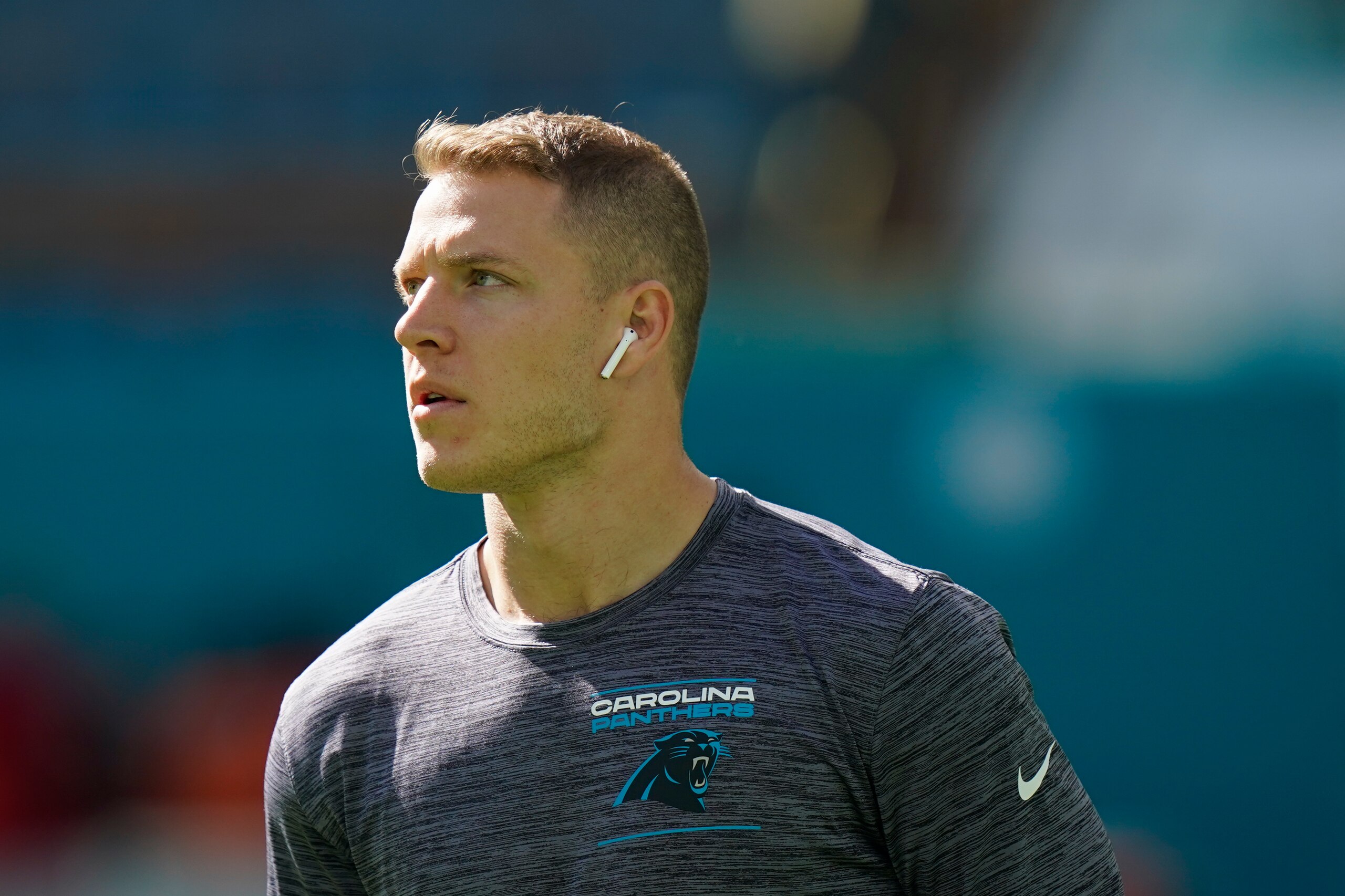 Carolina Panthers running back Christian McCaffrey (22) walks on the field ahead of an NFL football game against the Miami Dolphins, Sunday, Nov. 28, 2021, in Miami Gardens, Fla. (AP Photo/Lynne Sladky)