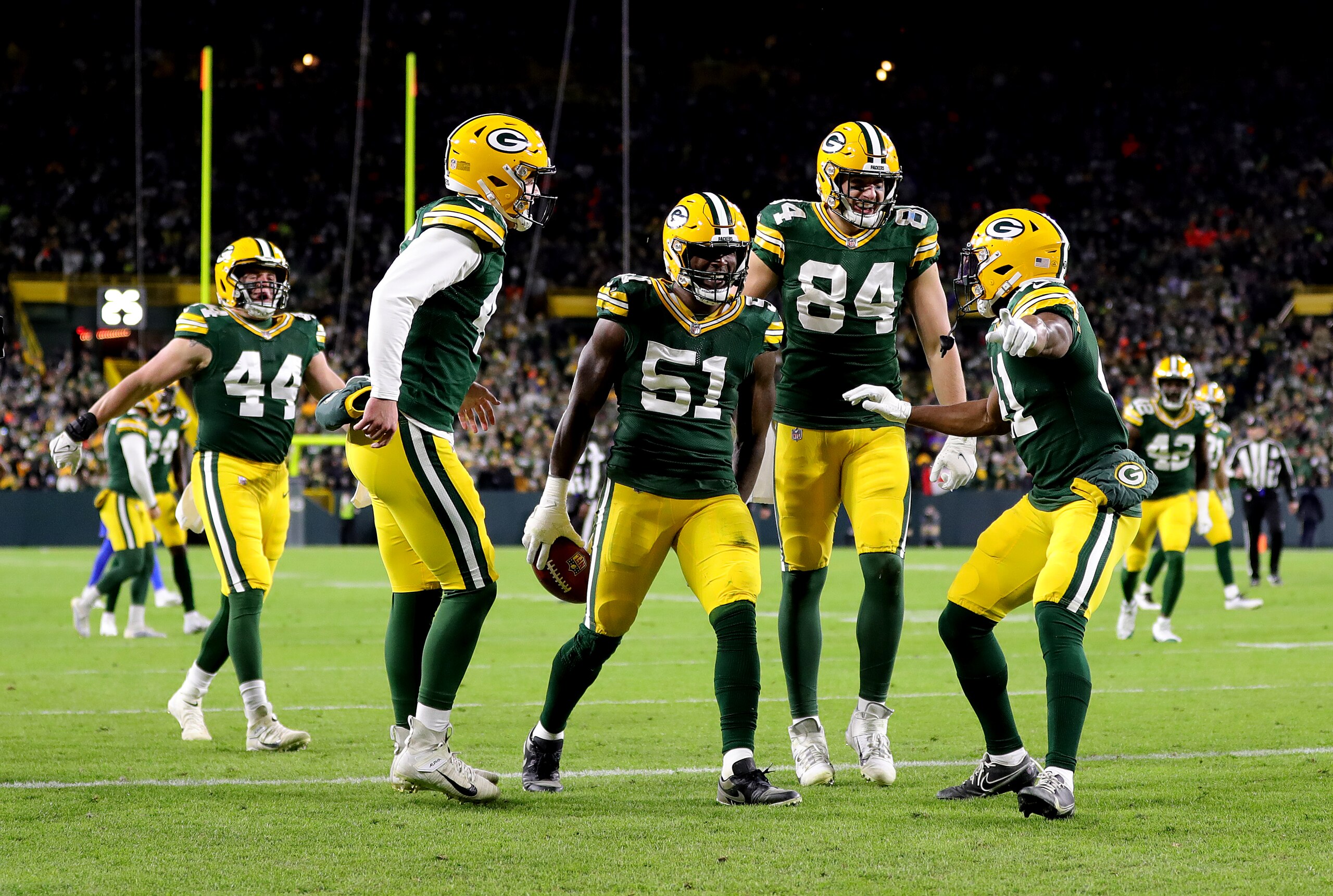 GREEN BAY, WISCONSIN - NOVEMBER 28: Krys Barnes #51 of the Green Bay Packers celebrates with teammates after recovering a fumbled punt catch by J.J. Koski #17 of the Los Angeles Rams (not pictured) during the third quarter at Lambeau Field on November 28, 2021 in Green Bay, Wisconsin. (Photo by Stacy Revere/Getty Images) GREEN BAY, WISCONSIN - NOVEMBER 28: Krys Barnes #51 of the Green Bay Packers celebrates with teammates after recovering a fumbled punt catch by J.J. Koski #17 of the Los Angeles Rams (not pictured) during the third quarter at Lambeau Field on November 28, 2021 in Green Bay, Wisconsin. (Photo by Stacy Revere/Getty Images)