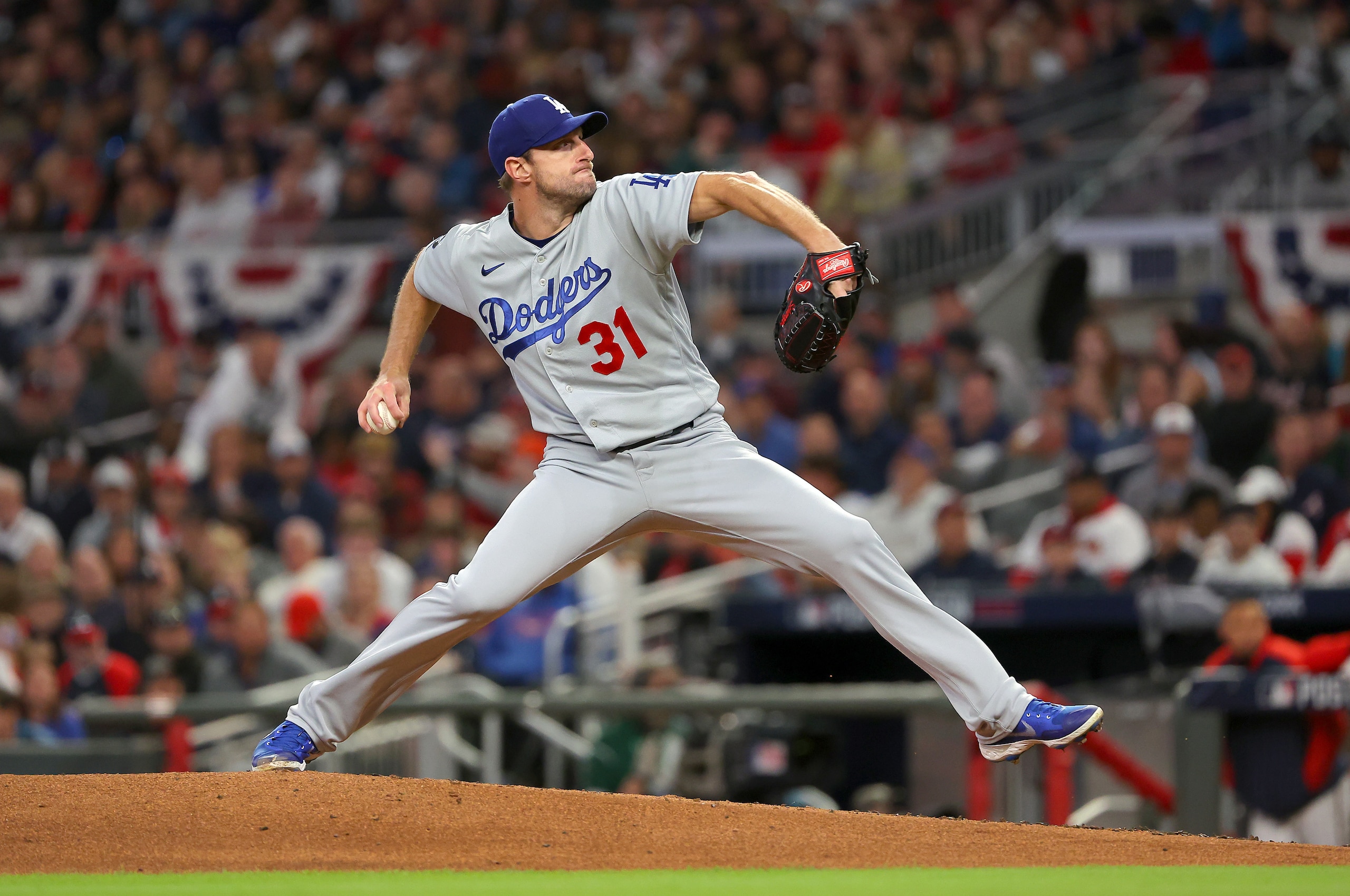 ATLANTA, GEORGIA - OCTOBER 17:  Max Scherzer #31 of the Los Angeles Dodgers pitches against the Atlanta Braves in the first inning of Game Two of the National League Championship Series at Truist Park on October 17, 2021 in Atlanta, Georgia. (Photo by Kevin C. Cox/Getty Images)