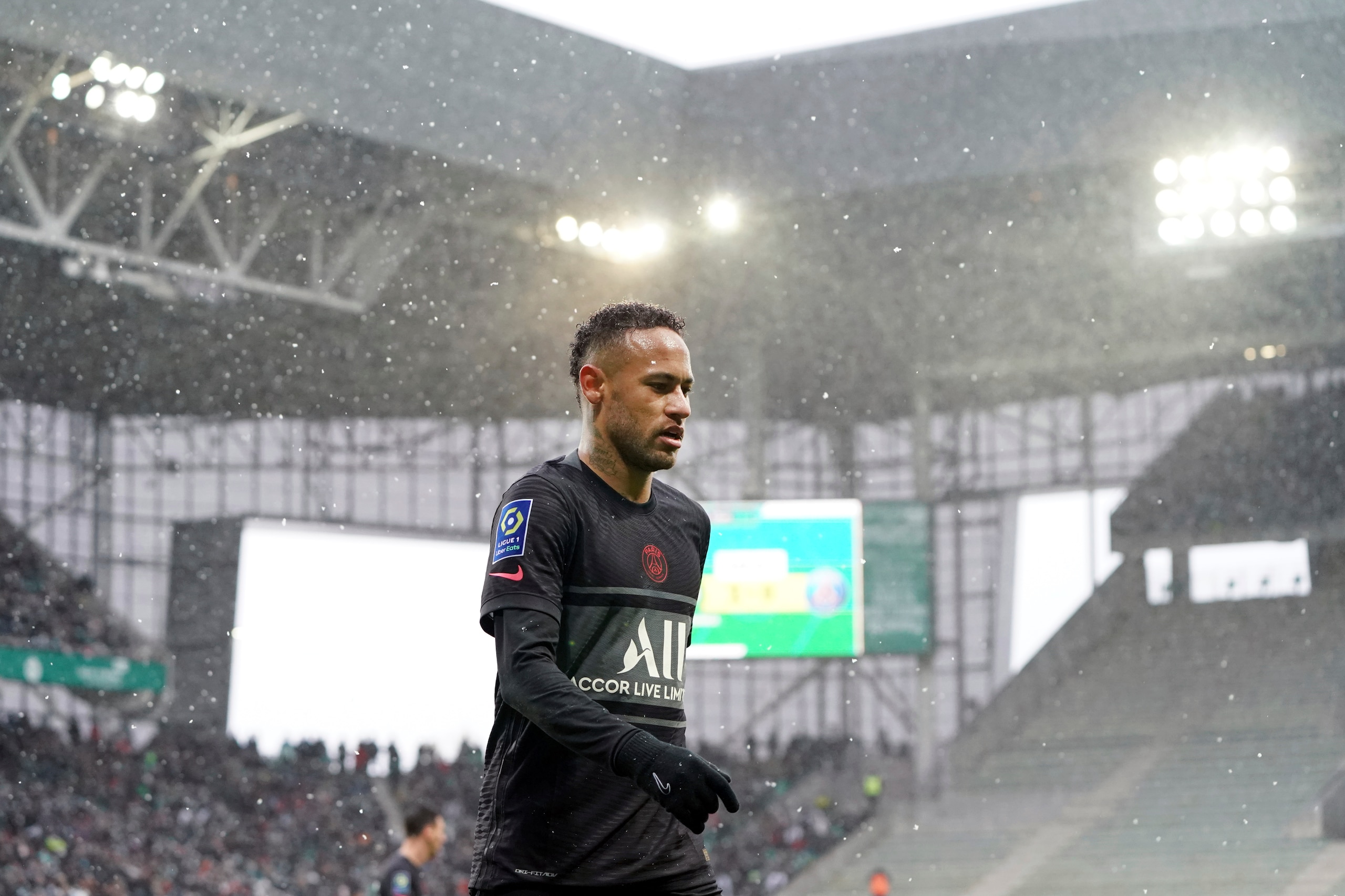PSG's Neymar walks on the field during the French League One soccer between Saint-Etienne and Paris Saint Germain, in Saint-Etienne, central France, Sunday, Nov. 28, 2021. (AP Photo/Laurent Cipriani)