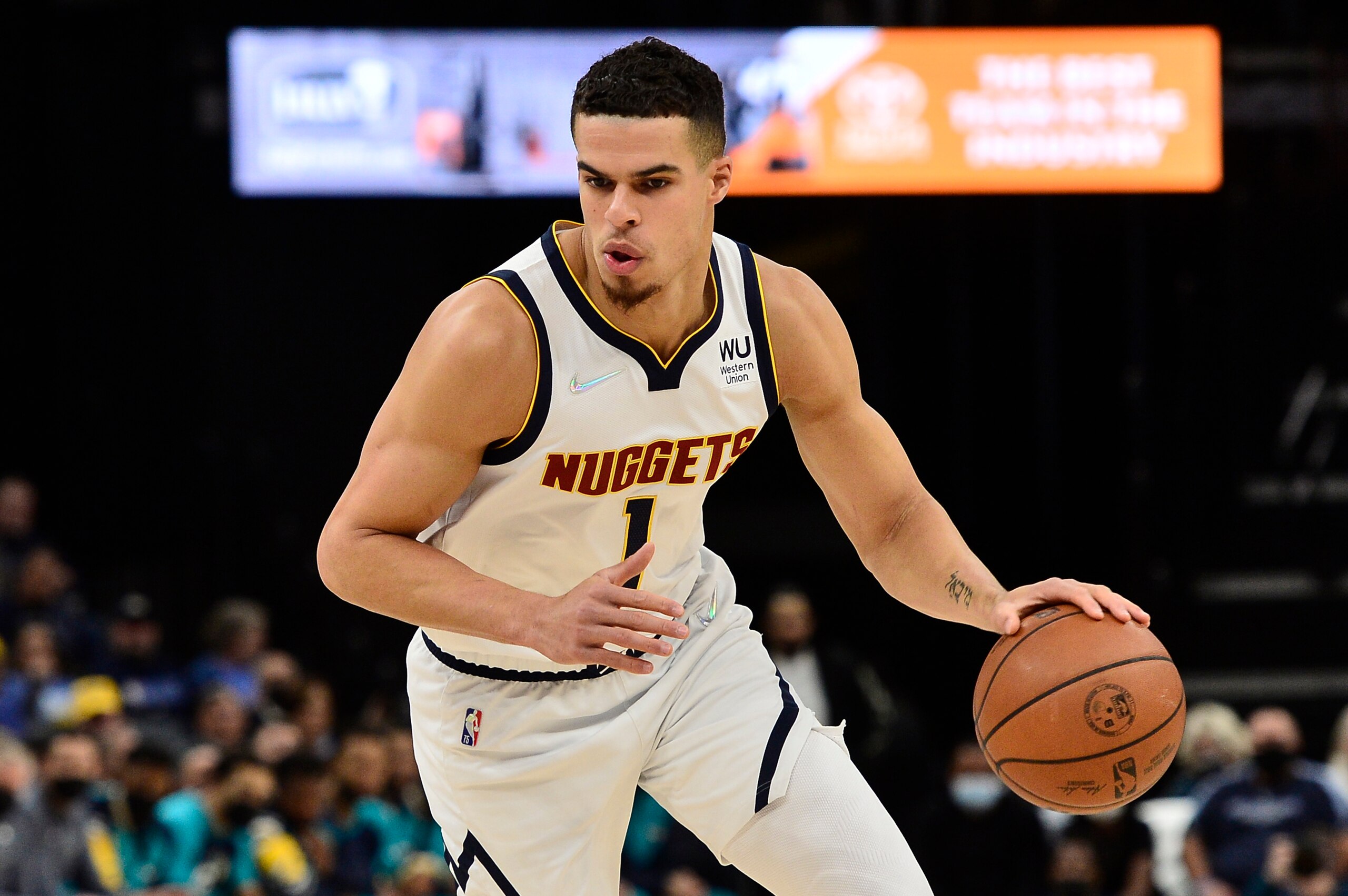 Denver Nuggets forward Michael Porter Jr. (1) handles the ball in the first half of an NBA basketball game against the Memphis Grizzlies Wednesday, Nov. 3, 2021, in Memphis, Tenn. (AP Photo/Brandon Dill)