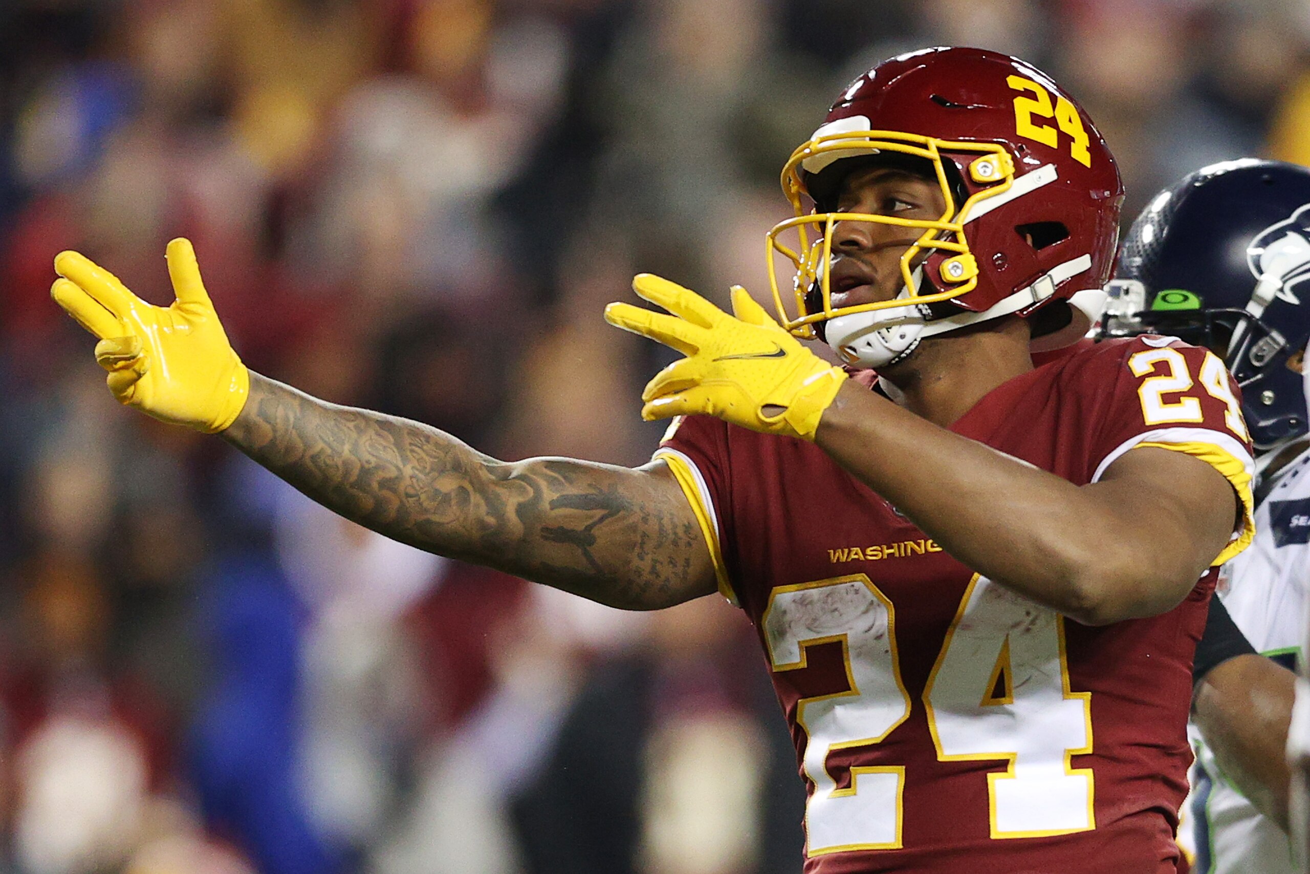 LANDOVER, MARYLAND - NOVEMBER 29: Antonio Gibson #24 of the Washington Football Team reacts after a first down against the Seattle Seahawks during the third quarter at FedExField on November 29, 2021 in Landover, Maryland. (Photo by Patrick Smith/Getty Images)