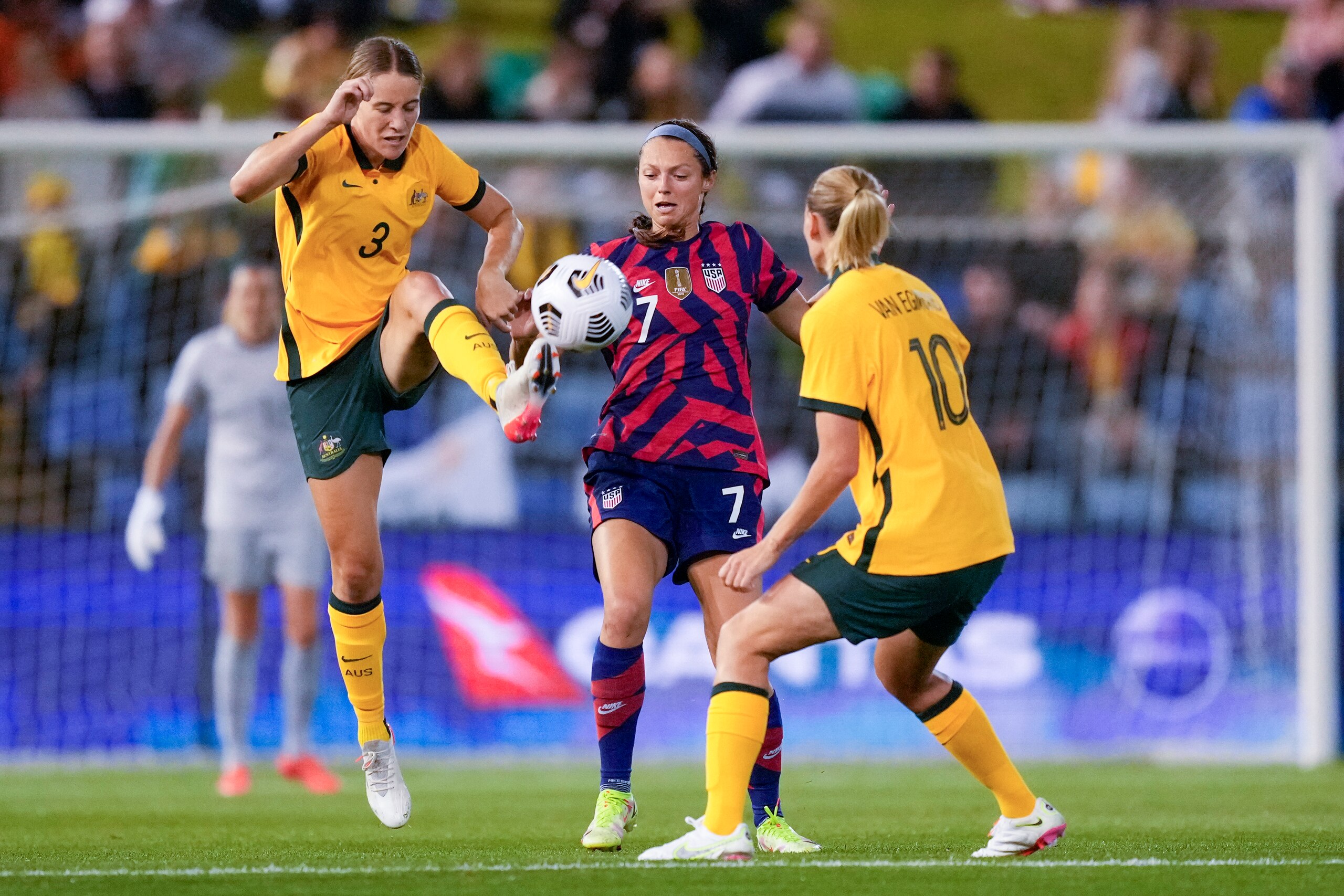 Matilda's Courtney Nevin , left, and United States' Ashley Hatch battle for the ball as Matilda's Emily van Egmond, right, watches during the international women's soccer match between the United States and Australia in Newcastle, Australia, Tuesday, Nov. 30, 2021. (AP Photo/Mark Baker)