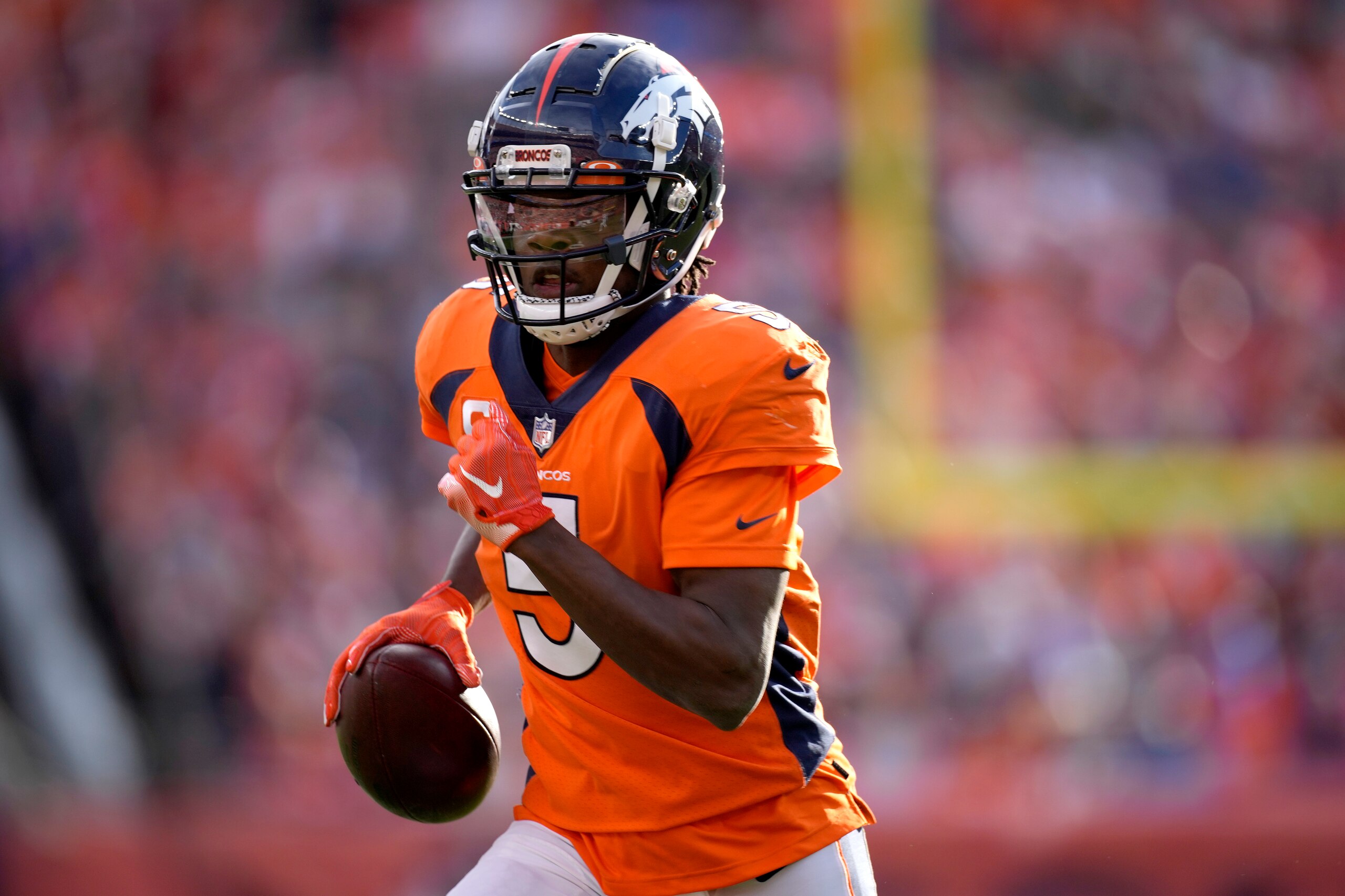Denver Broncos quarterback Teddy Bridgewater (5) runs for a touchdown against the Los Angeles Chargers during the first half of an NFL football game, Sunday, Nov. 28, 2021, in Denver. (AP Photo/David Zalubowski)