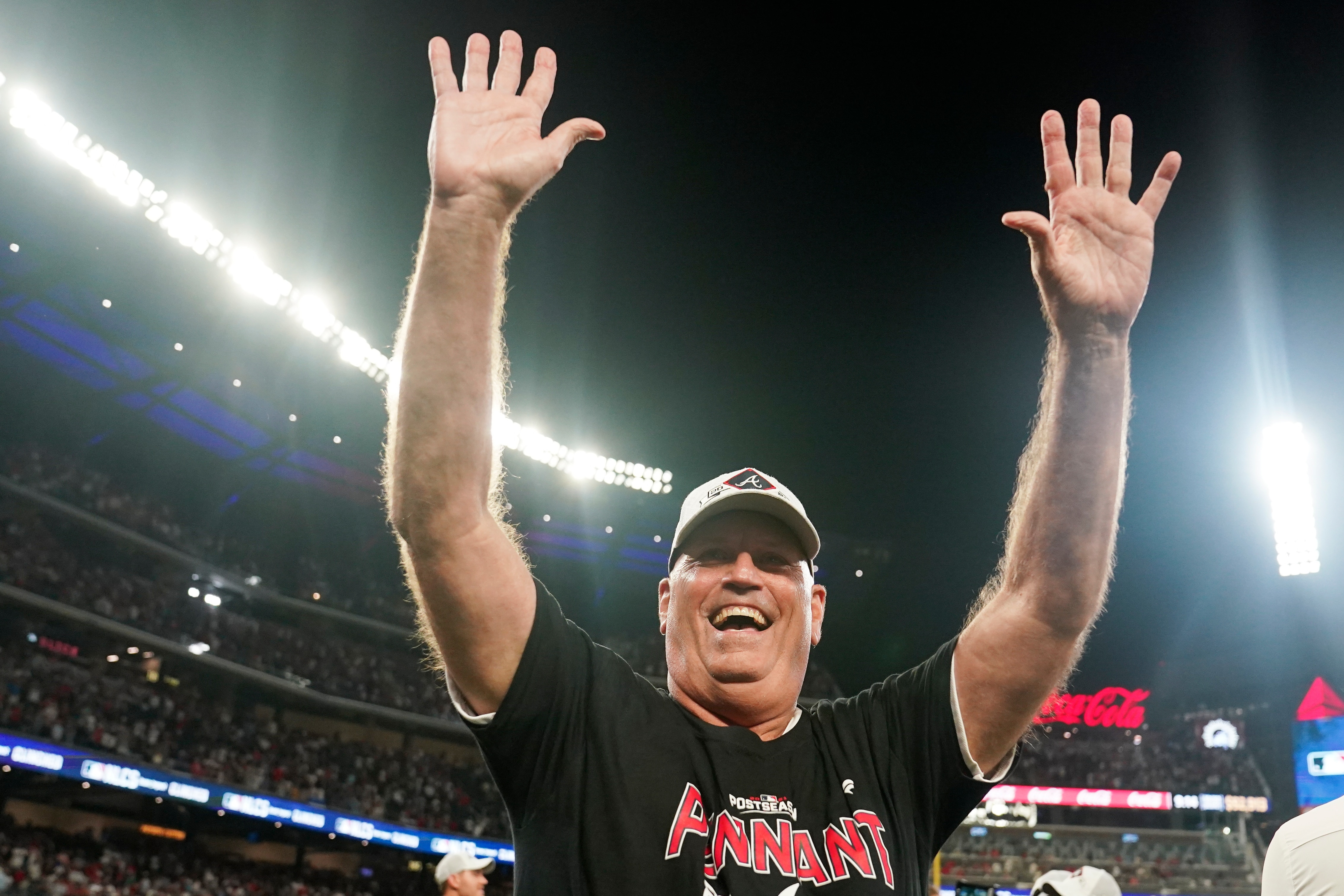 Atlanta Braves manager Brian Snitker celebrates after Game 4 of a baseball National League Division Series against the Milwaukee Brewers, Tuesday, Oct. 12, 2021, in Atlanta. The Atlanta Braves won 5-4 to advance to the NLCS. (AP Photo/Brynn Anderson)