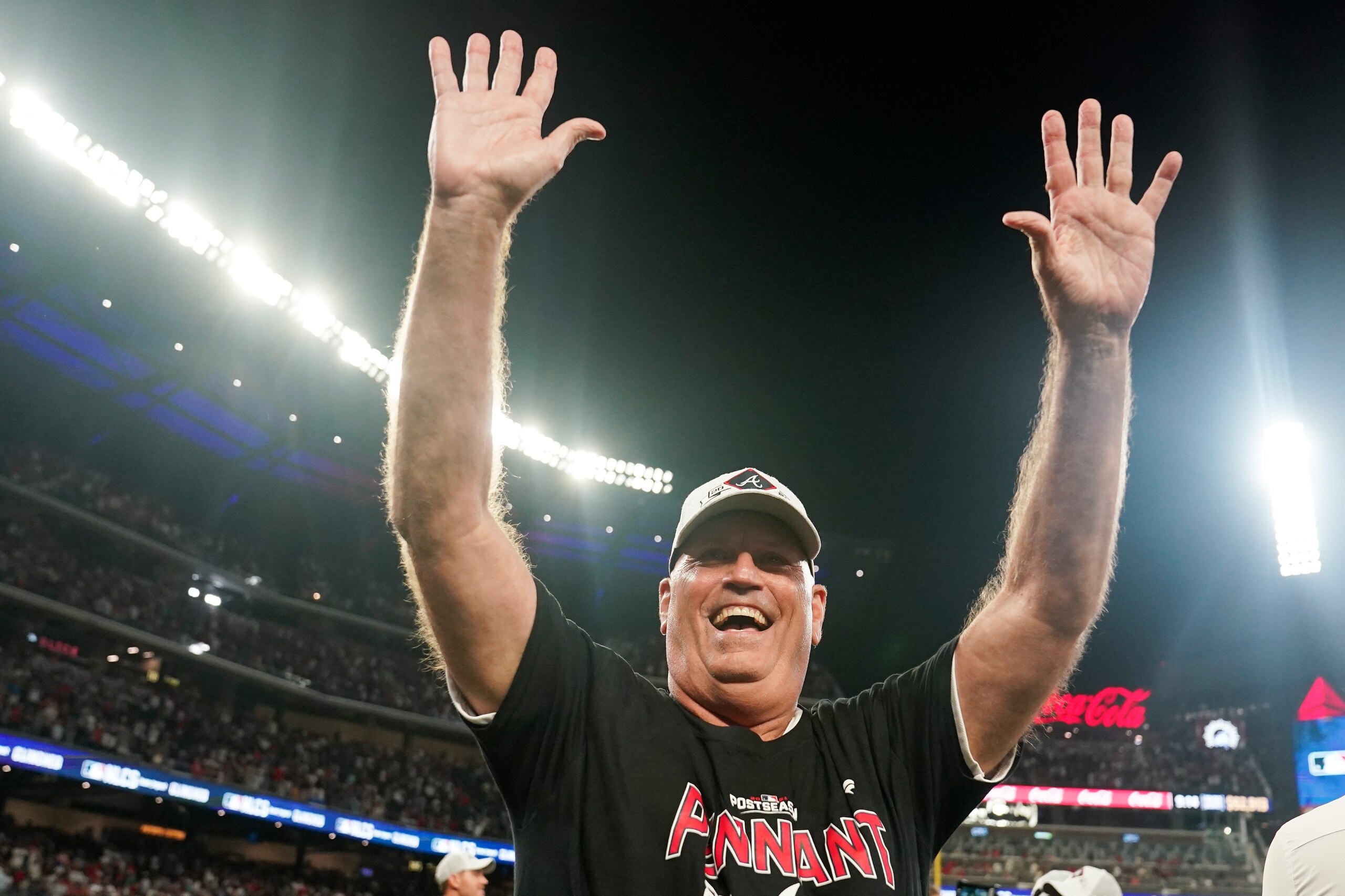 Atlanta Braves manager Brian Snitker celebrates after Game 4 of a baseball National League Division Series against the Milwaukee Brewers, Tuesday, Oct. 12, 2021, in Atlanta. The Atlanta Braves won 5-4 to advance to the NLCS. (AP Photo/Brynn Anderson)