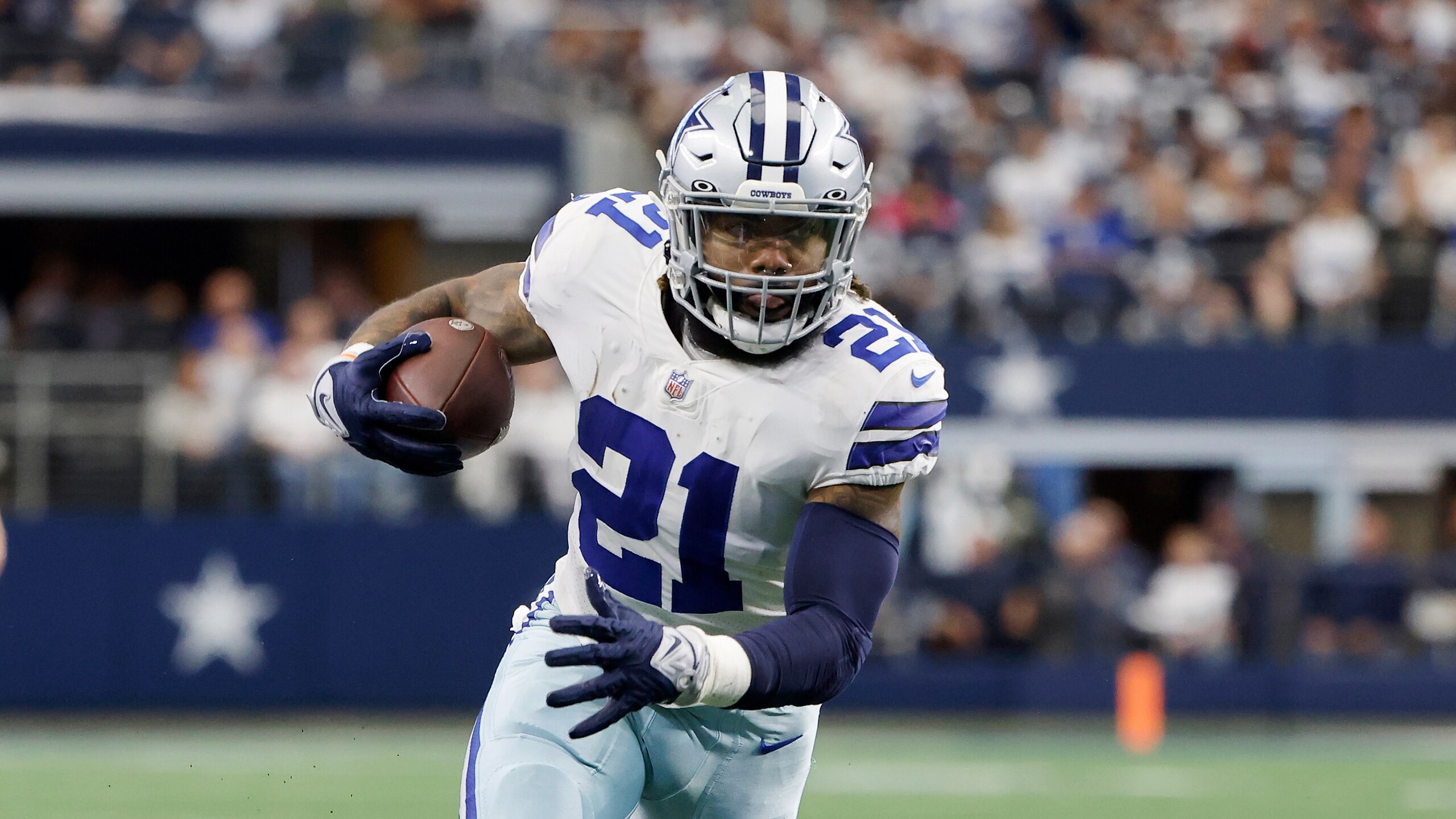 Dallas Cowboys running back Ezekiel Elliott (21) runs against the Atlanta Falcons during an NFL Football game in Arlington, Texas, Sunday, Nov. 14, 2021. (AP Photo/Michael Ainsworth)