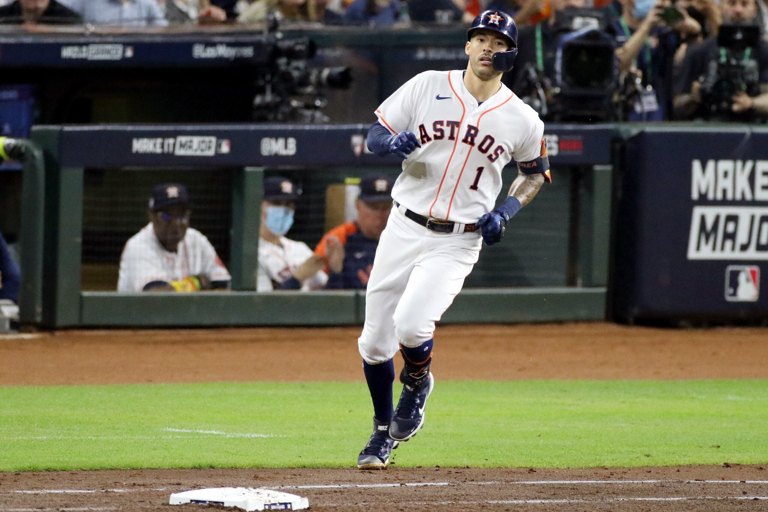 HOUSTON, TX - NOVEMBER 02:  Carlos Correa #1 of the Houston Astros runs to first base after hitting a single in the fourth inning during Game 6 of the 2021 World Series between the Atlanta Braves and the Houston Astros at Minute Maid Park on Tuesday, November 2, 2021 in Houston, Texas. (Photo by Michael Starghill/MLB Photos via Getty Images)
