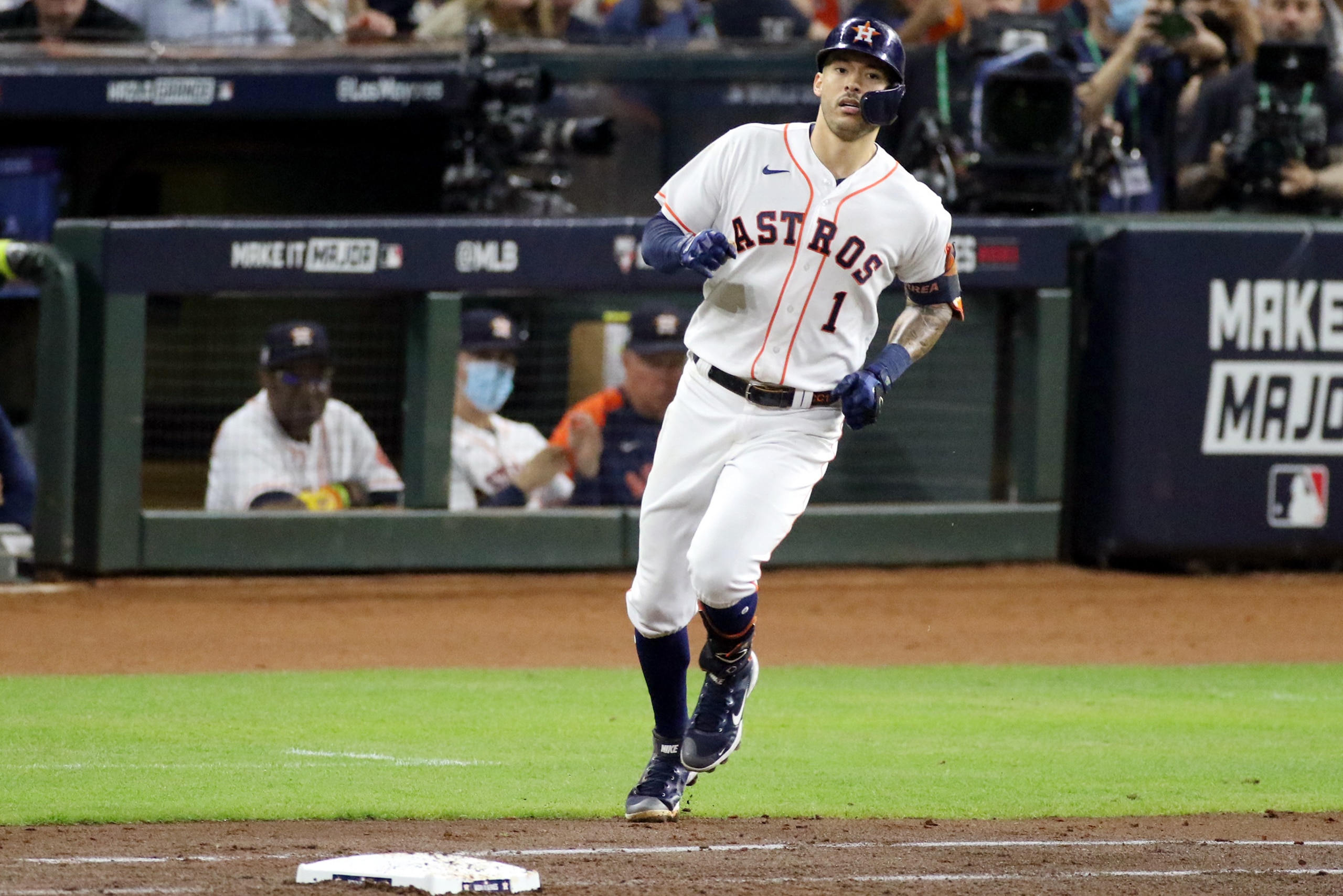 HOUSTON, TX - NOVEMBER 02:  Carlos Correa #1 of the Houston Astros runs to first base after hitting a single in the fourth inning during Game 6 of the 2021 World Series between the Atlanta Braves and the Houston Astros at Minute Maid Park on Tuesday, November 2, 2021 in Houston, Texas. (Photo by Michael Starghill/MLB Photos via Getty Images)