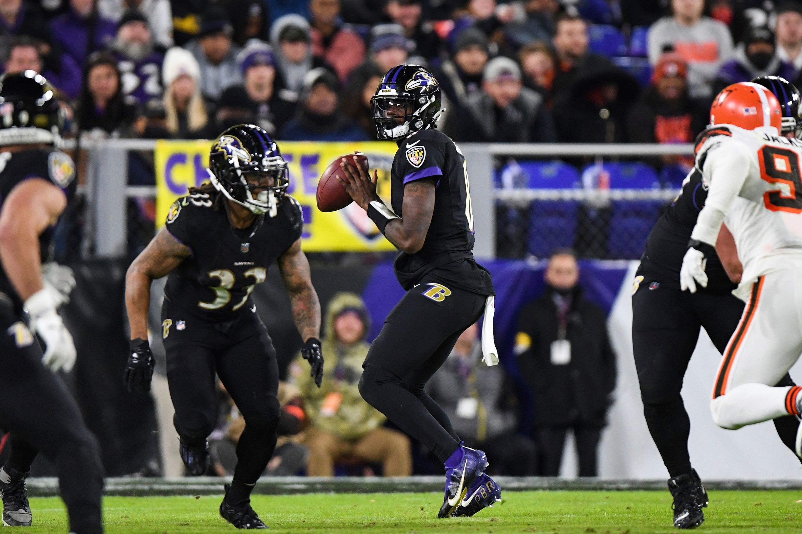 Baltimore Ravens quarterback Lamar Jackson (8) looks to pass the ball during the second half of an NFL football game against the Cleveland Browns, Sunday, Nov. 28, 2021, in Baltimore. (AP Photo/Terrance Williams)