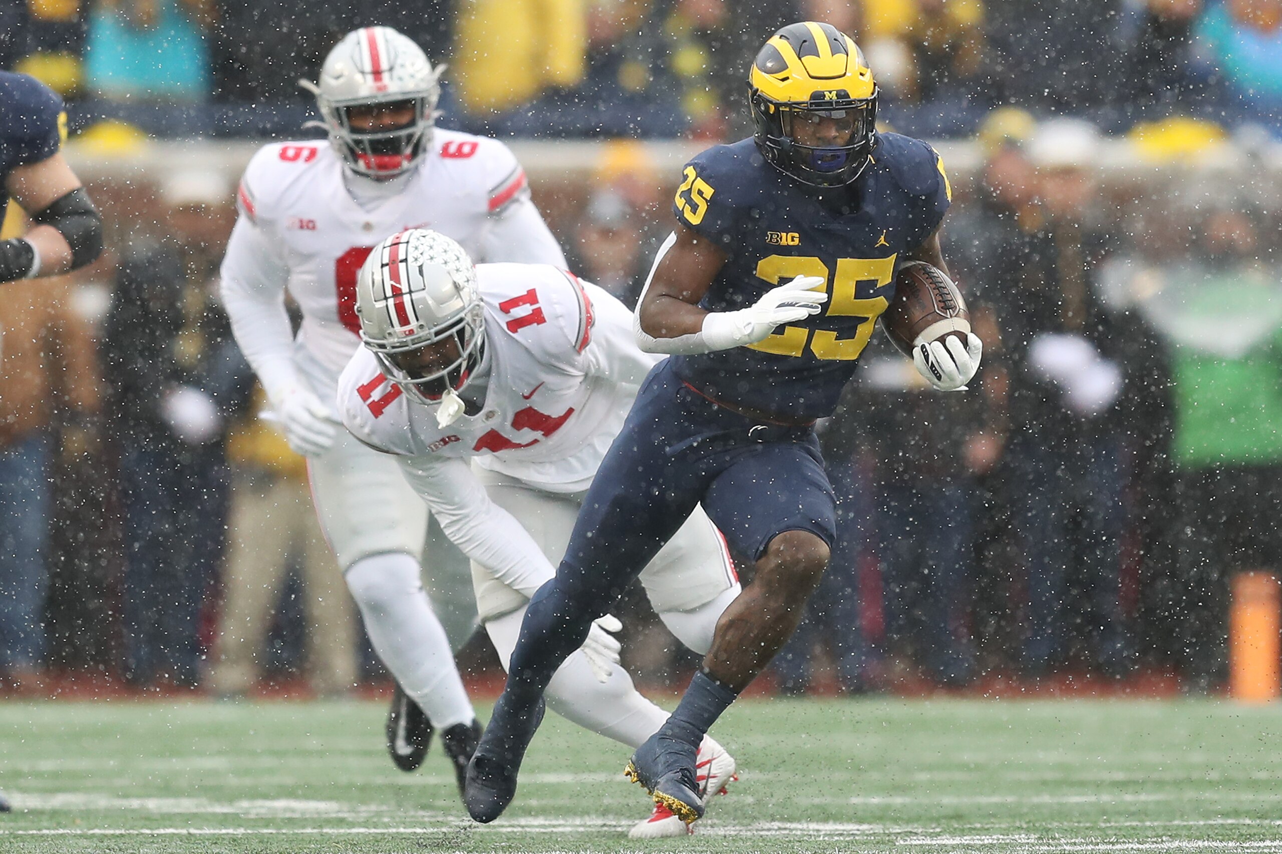 ANN ARBOR, MICHIGAN - NOVEMBER 27: Hassan Haskins #25 of the Michigan Wolverines carries the ball against the Ohio State Buckeyes during the first quarter at Michigan Stadium on November 27, 2021 in Ann Arbor, Michigan. (Photo by Mike Mulholland/Getty Images)