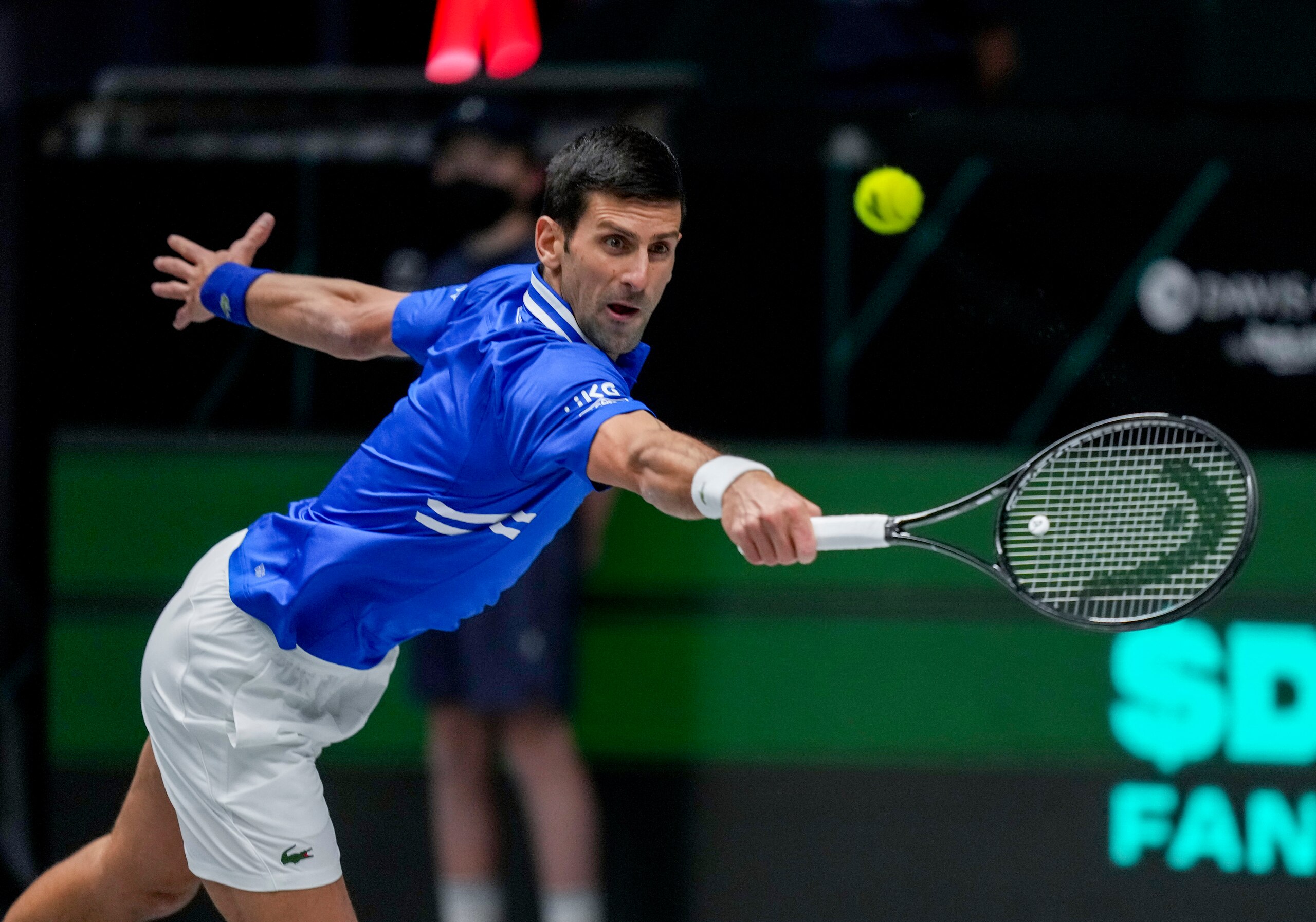 Serbia's Novak Djokovic hits a backhand against Austria's Dennis Novak during a Davis Cup group F match between Serbia and Austria in Innsbruck, Austria, Friday, Nov. 26, 2021. (Photo/Michael Probst)