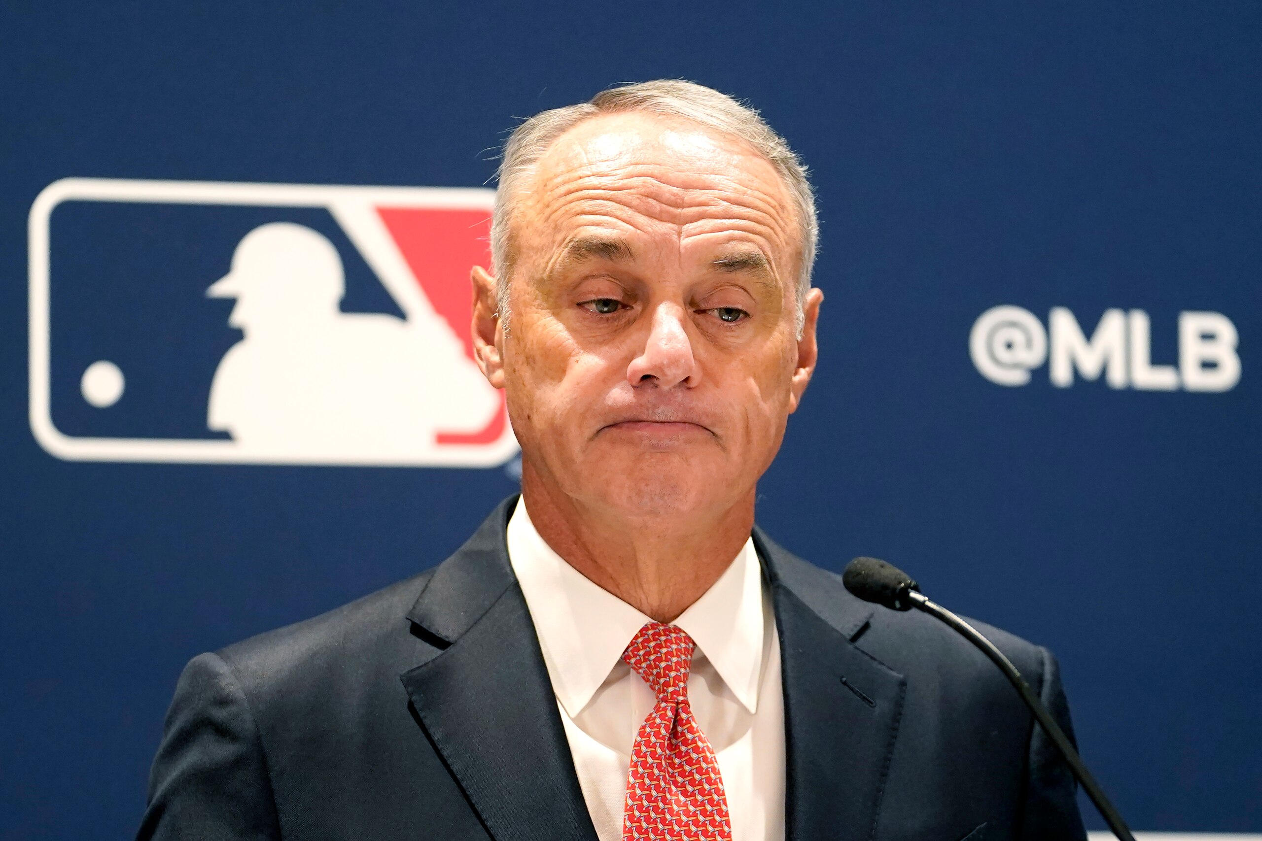 Major League Baseball commissioner Rob Manfred listens to a question Thursday, Nov. 18, 2021, during a news conference in Chicago. (AP Photo/Charles Rex Arbogast)