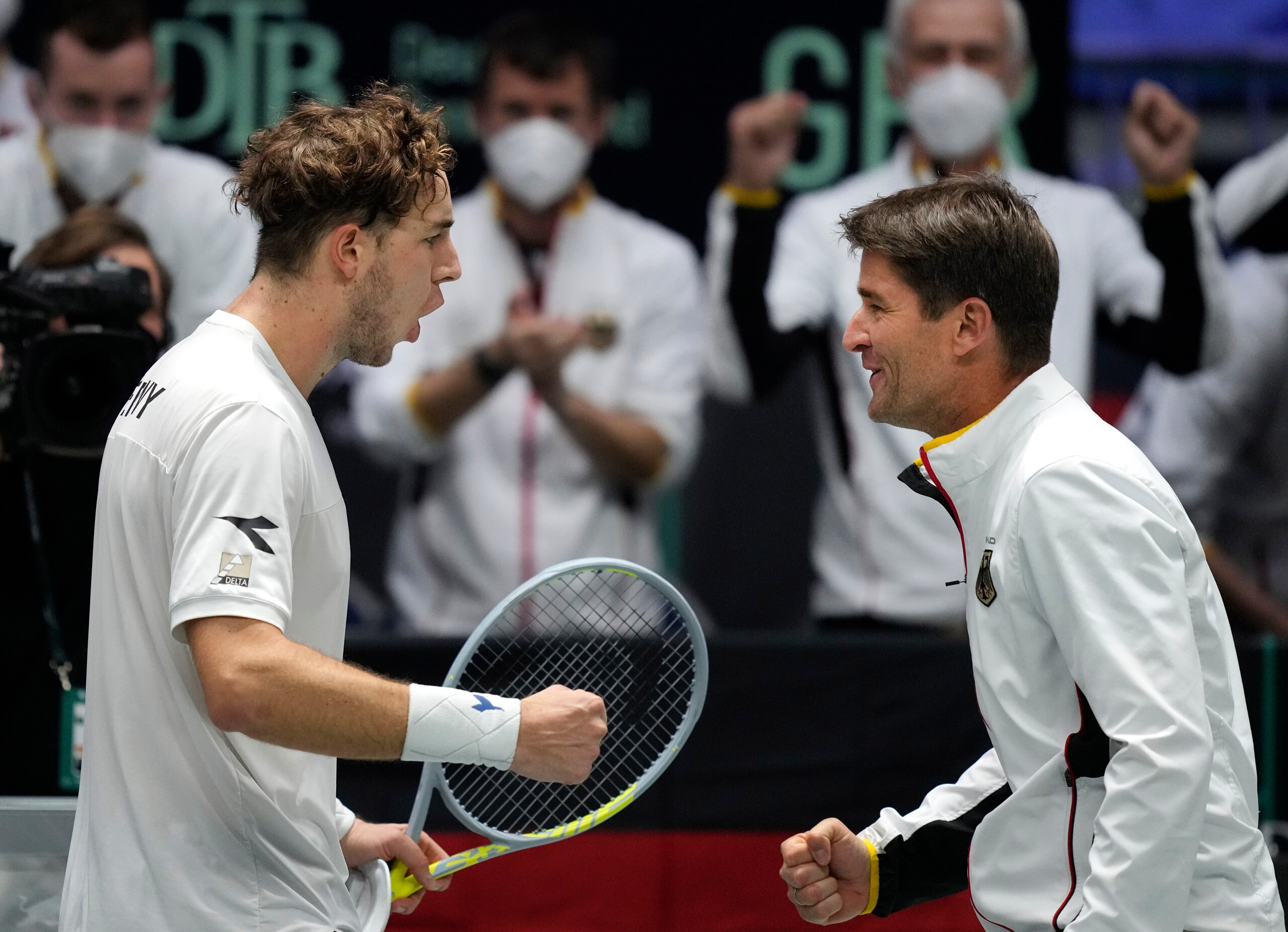 Germany's Jan-Lennard Struff celebrates with coach Michael Kohlmann after winning against Great Britain's Cameron Norrie during a Davis Cup quarter final match match between Great Britain and Germany in Innsbruck, Austria, Tuesday, Nov. 30, 2021. (Photo/Michael Probst)