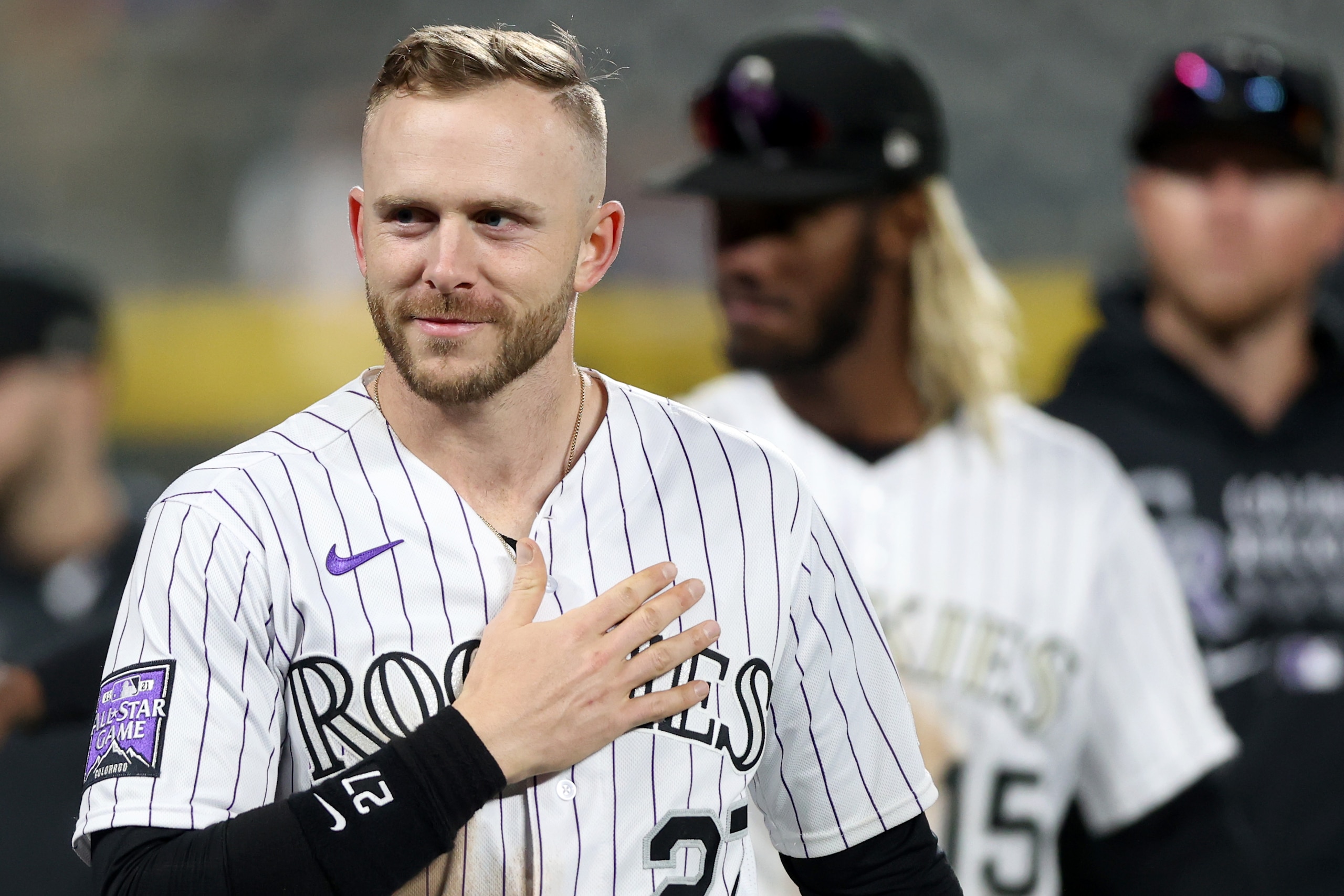 DENVER, COLORADO - SEPTEMBER 29: Trevor Story #27  of the Colorado Rockies acknowledges the crowd as the team walks around the warning track after their final home game and win over the Washington Nationals at Coors Field on September 29, 2021 in Denver, Colorado. (Photo by Matthew Stockman/Getty Images)