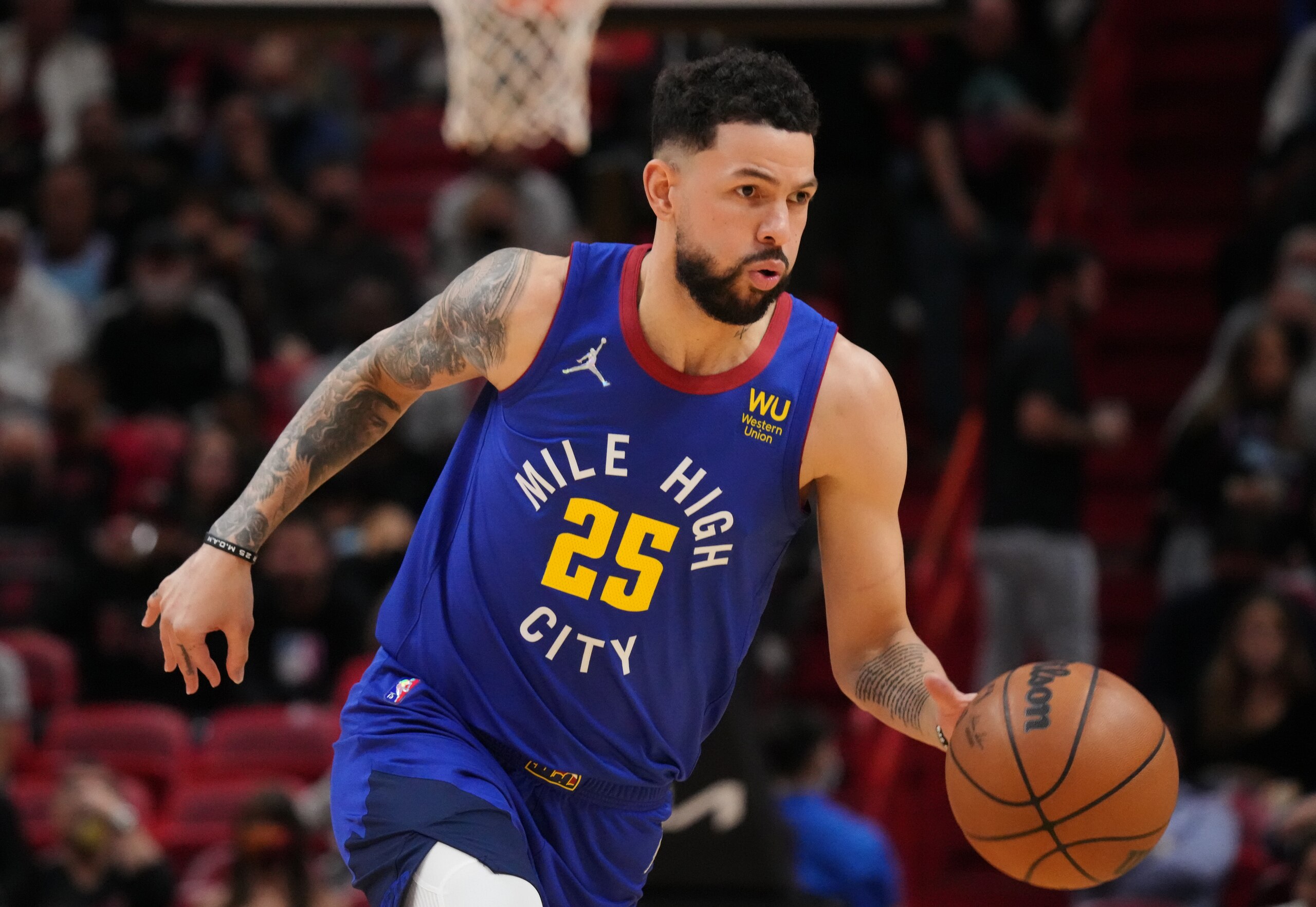 MIAMI, FLORIDA - NOVEMBER 29: Austin Rivers #25 of the Denver Nuggets dribbles the ball up the court against the Miami Heat during the first half at FTX Arena on November 29, 2021 in Miami, Florida. NOTE TO USER: User expressly acknowledges and agrees that, by downloading and or using this photograph, User is consenting to the terms and conditions of the Getty Images License Agreement. (Photo by Mark Brown/Getty Images)