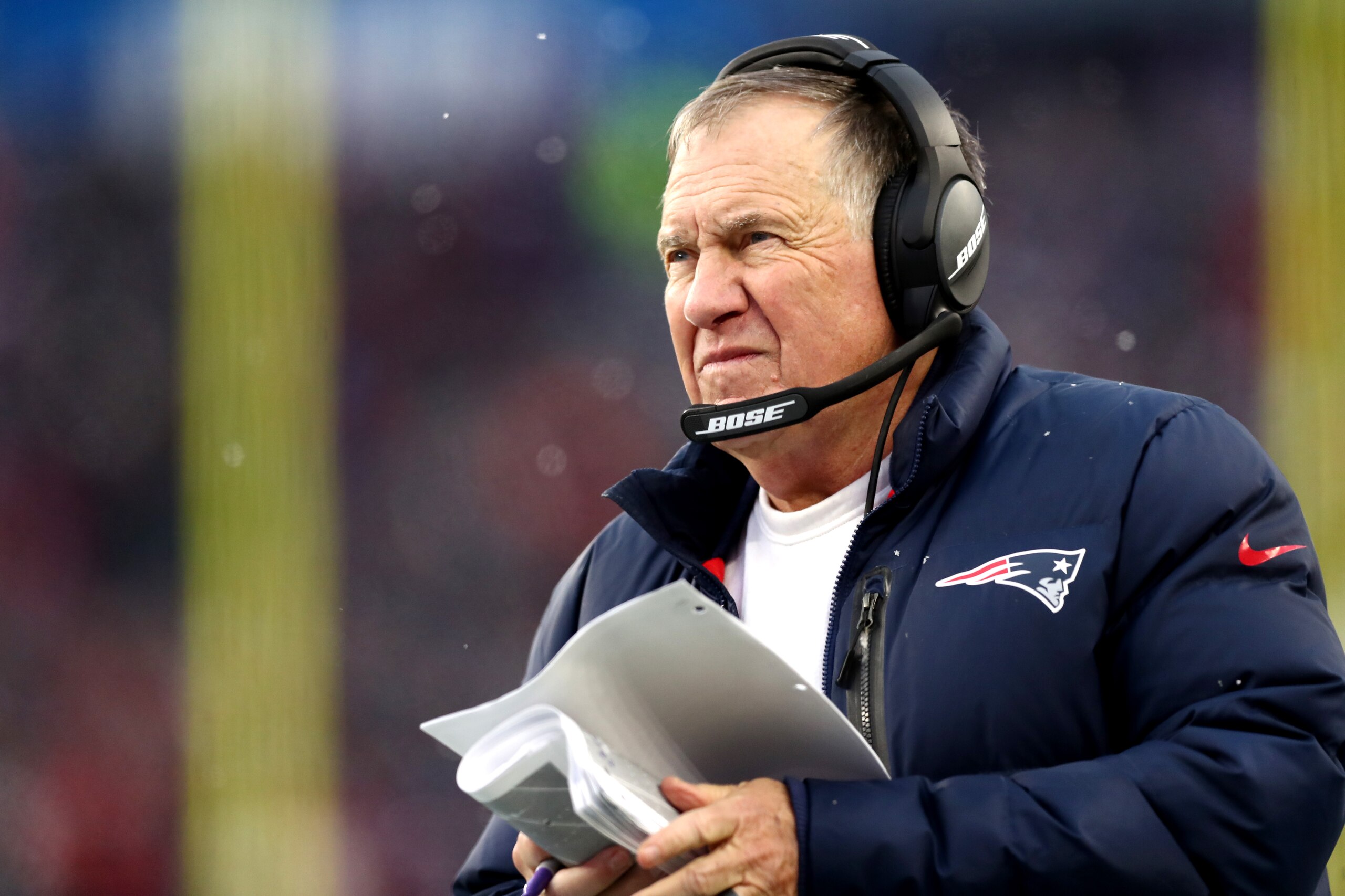 FOXBOROUGH, MASSACHUSETTS - NOVEMBER 28: Head coach Bill Belichick of the New England Patriots looks on from the side line during the second half of the game against the Tennessee Titans at Gillette Stadium on November 28, 2021 in Foxborough, Massachusetts. (Photo by Adam Glanzman/Getty Images) FOXBOROUGH, MASSACHUSETTS - NOVEMBER 28: Head coach Bill Belichick of the New England Patriots looks on from the side line during the second half of the game against the Tennessee Titans at Gillette Stadium on November 28, 2021 in Foxborough, Massachusetts. (Photo by Adam Glanzman/Getty Images)