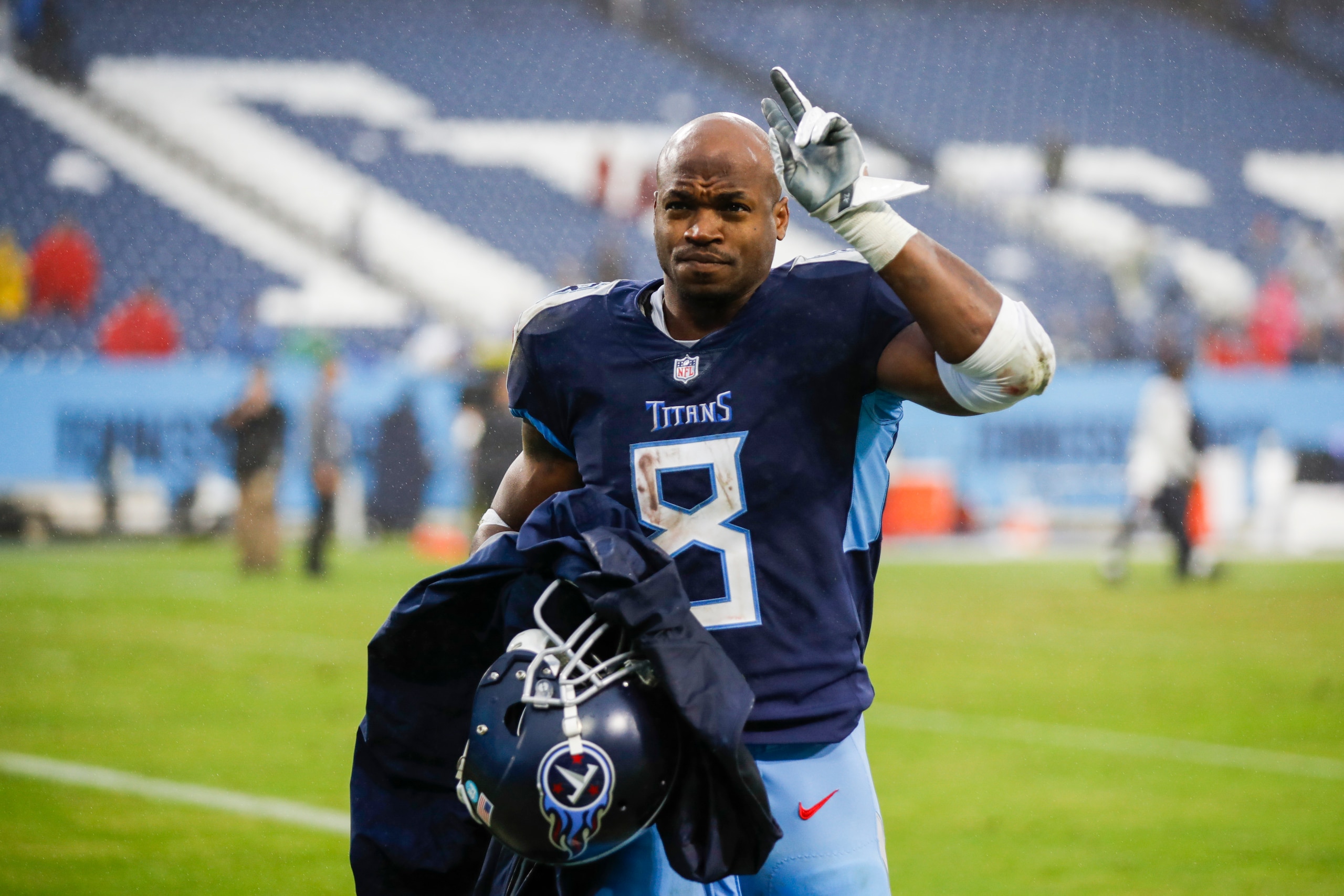 NASHVILLE, TENNESSEE - NOVEMBER 21: Adrian Peterson #8 of the Tennessee Titans waves as he runs off the field after the game against the Houston Texans at Nissan Stadium on November 21, 2021 in Nashville, Tennessee. (Photo by Silas Walker/Getty Images)